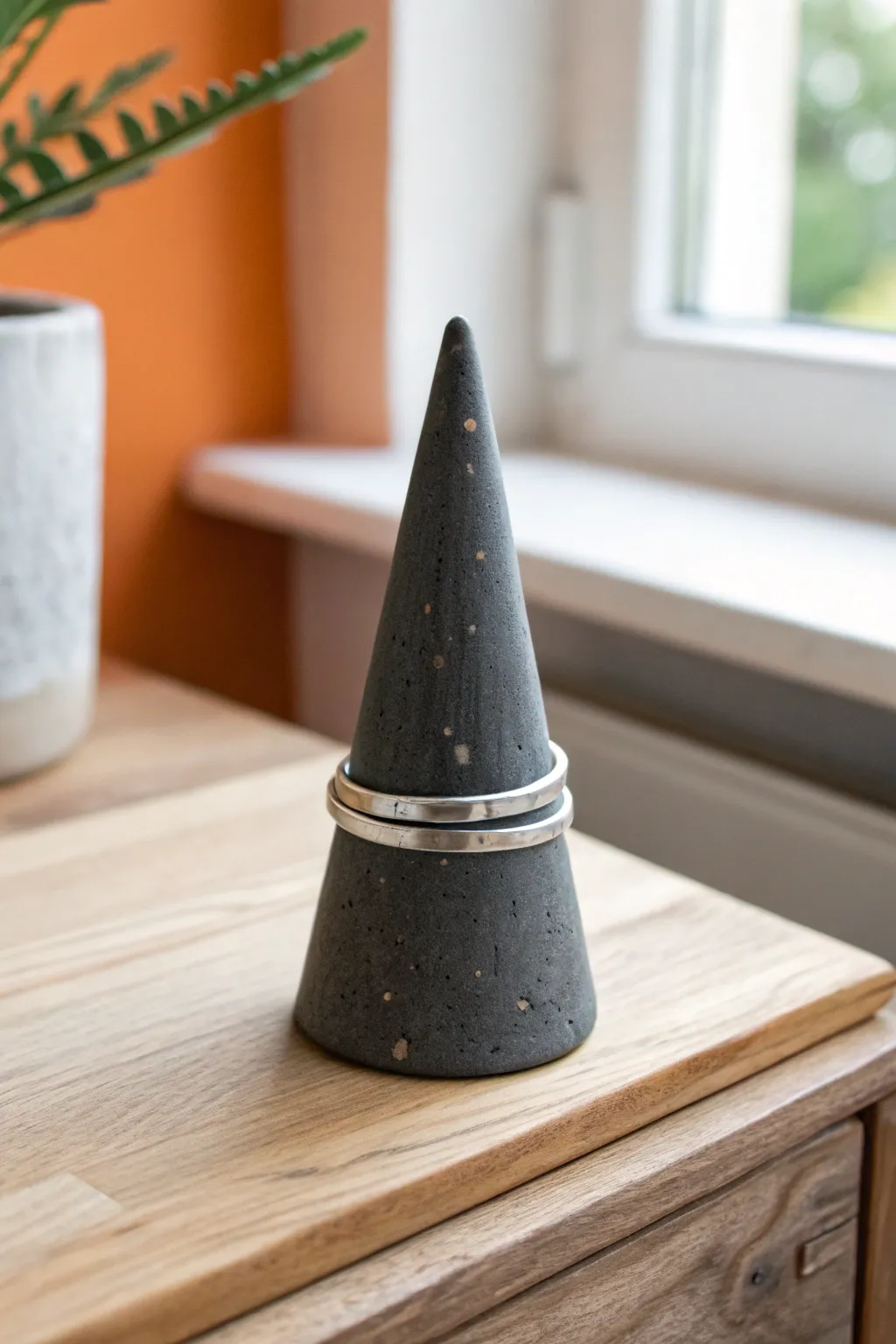 Minimalist dark-glazed ring cone keeps his daily band safe, sleek, and handmade.