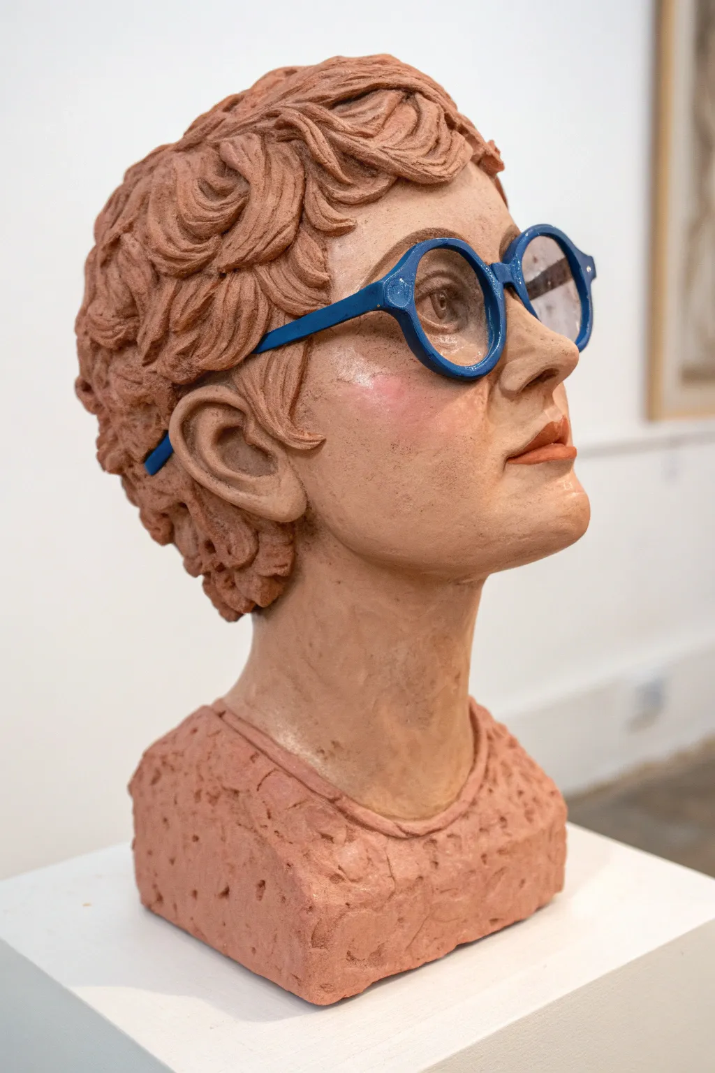 Charming clay portrait head with bold glasses and brows, simple details to capture a loved one.