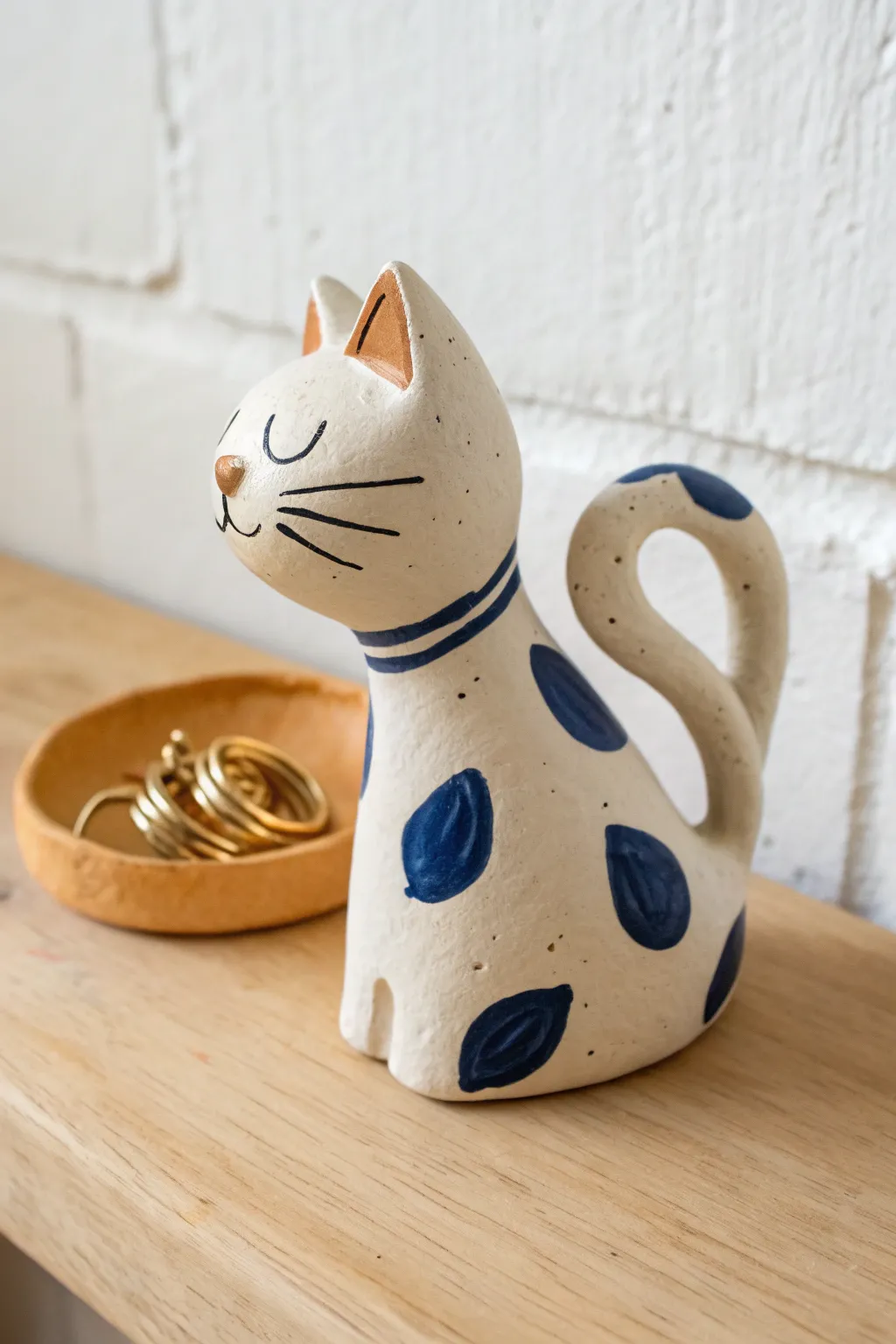 A whimsical clay ring holder that doubles as decor and makes your jewelry photos pop.