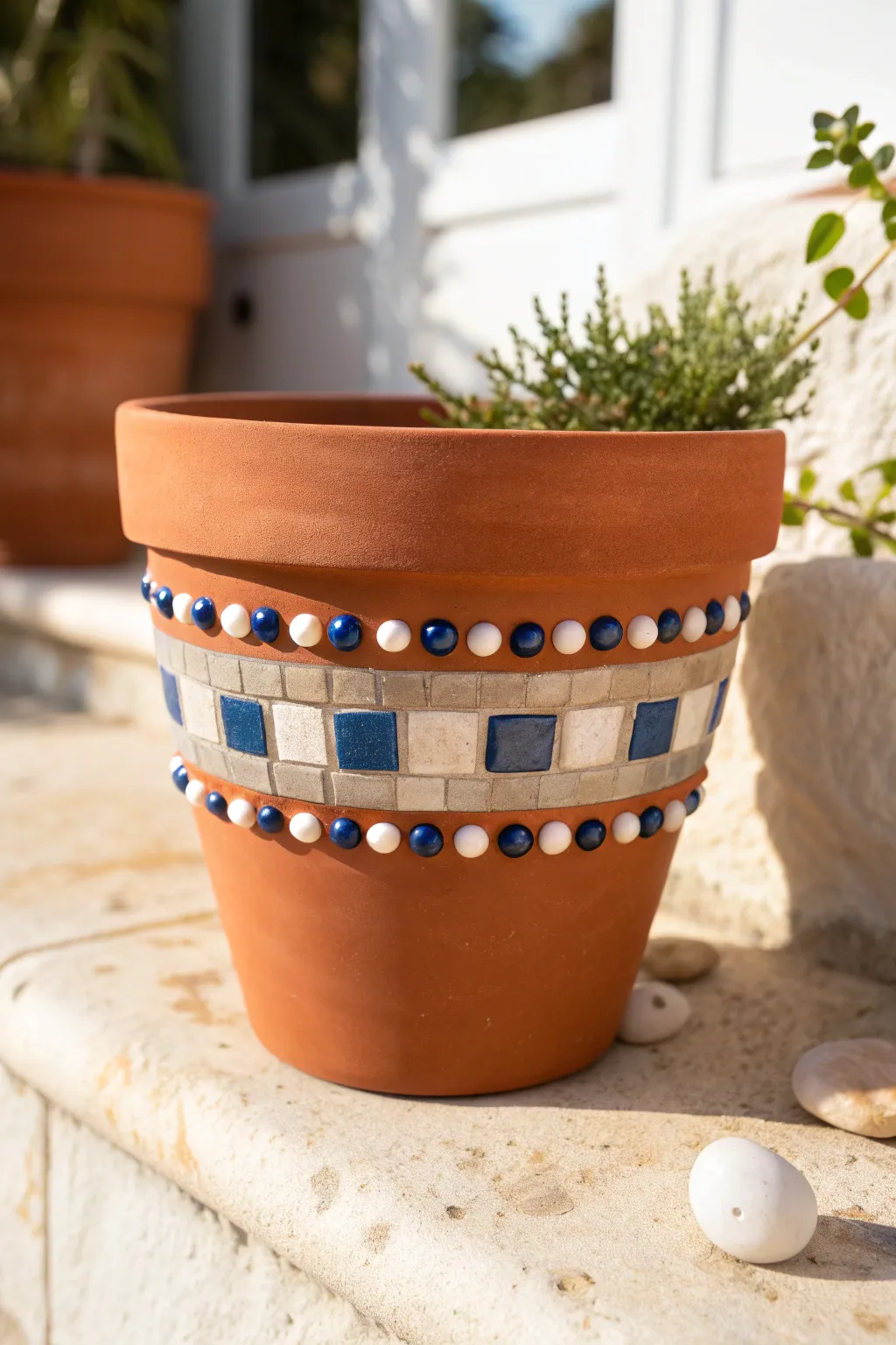 Sunlit terracotta pot with simple mirror mosaic bands and beads for easy boho sparkle.