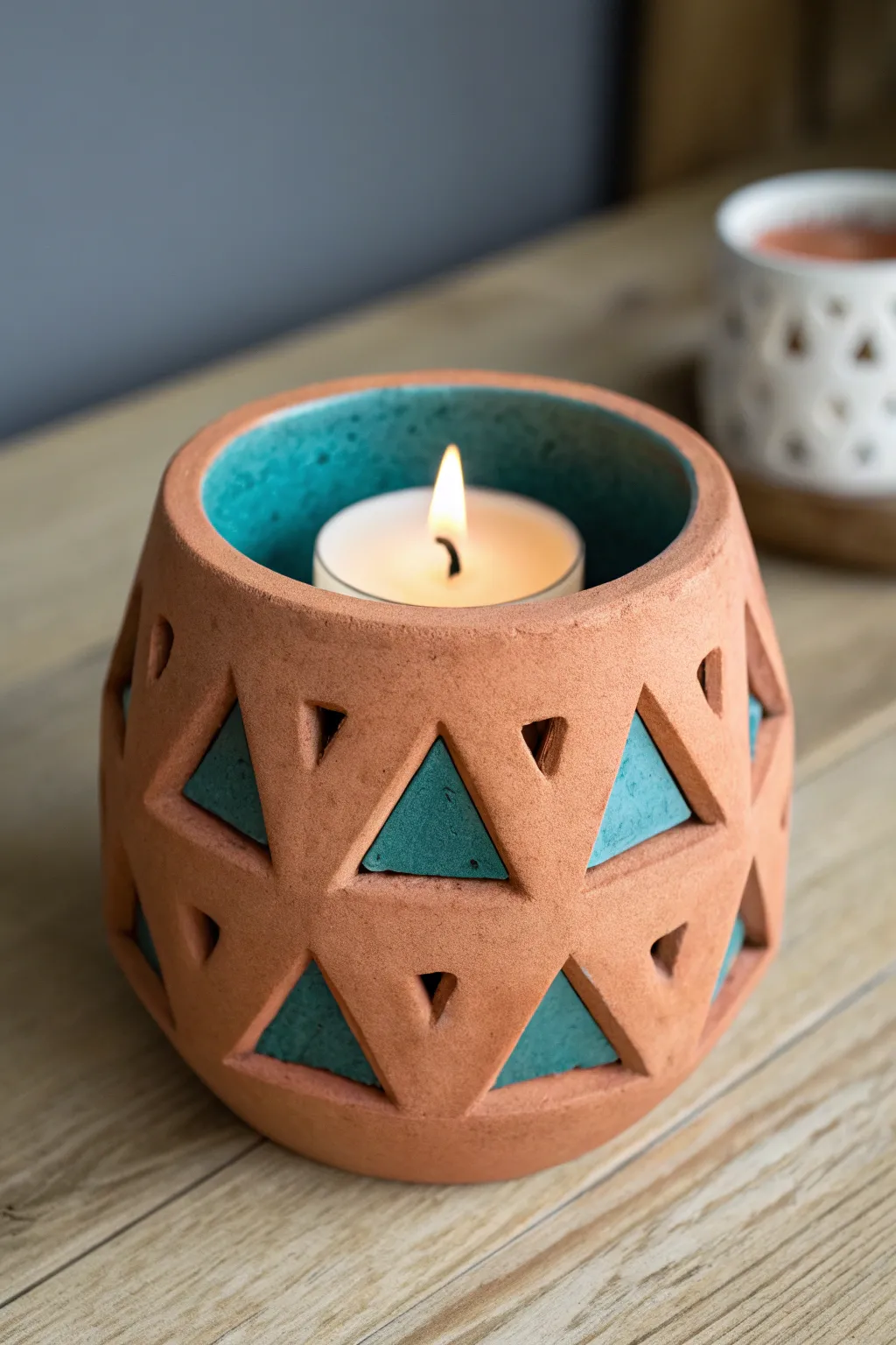 Chunky clay cutout candle holder with warm glow, minimalist boho style for cozy evenings
