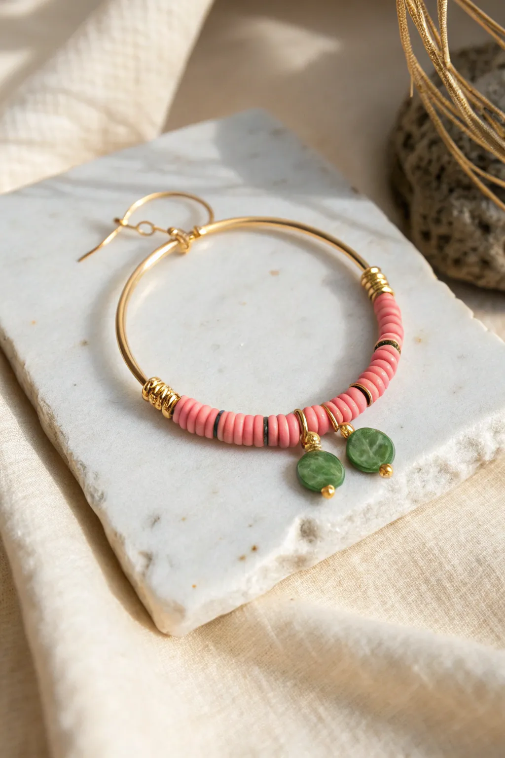 Strawberry pink and leafy green heishi hoop, minimal and playful for easy DIY clay bead earrings.