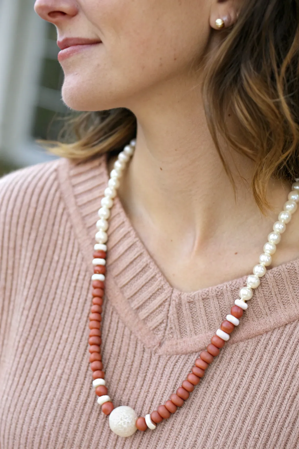 Pearl and clay heishi beads meet in a sweet, polished necklace perfect for cozy sweaters.