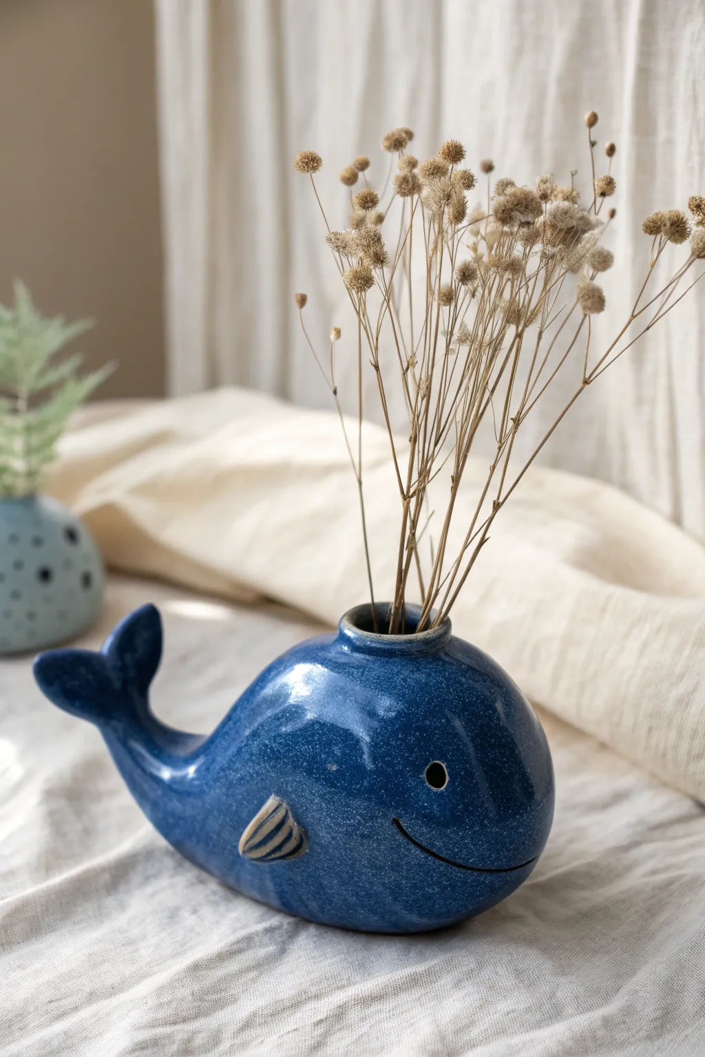 Whale double pinch pot bud vase with a tiny blowhole opening, simple stems, bold minimal charm