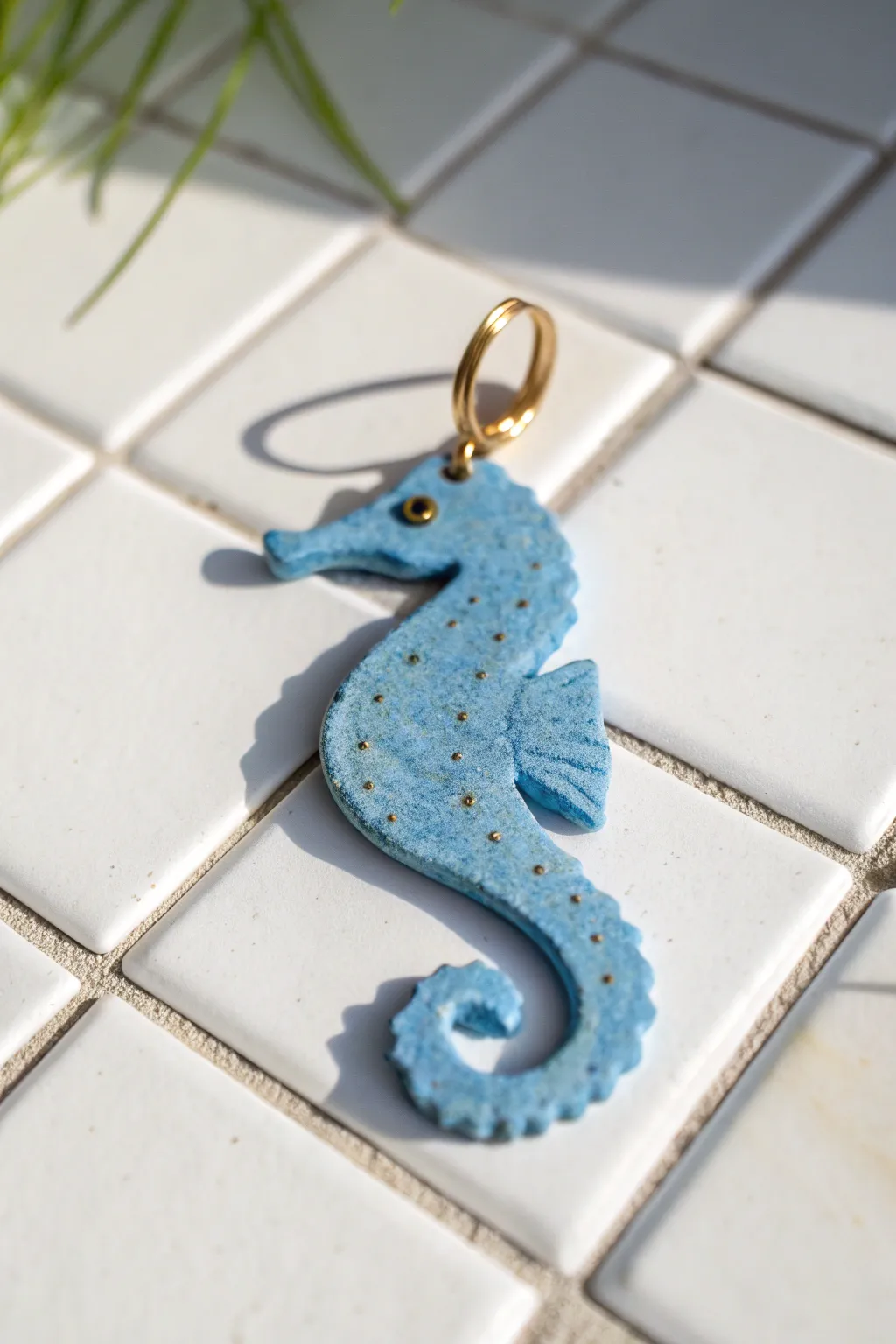 Minimal cobalt-blue seahorse clay pendant with clean lines, bold contrast, and boho charm.