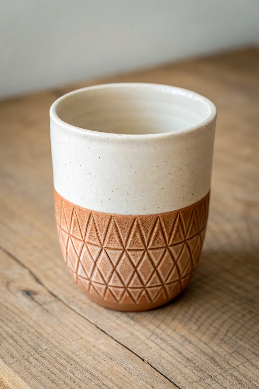 Easy crosshatch carving adds a cozy grip to a minimalist cup with warm terracotta contrast.