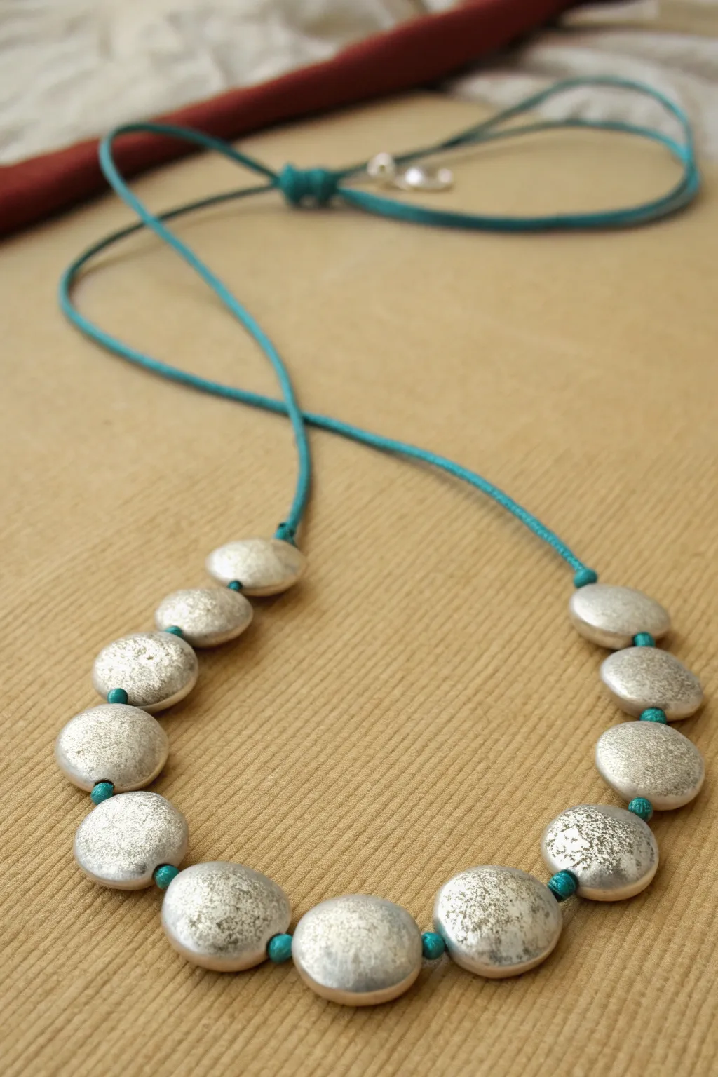 Lightweight hollow metal clay lentil beads in a minimalist curve, simple, modern, handmade shine.