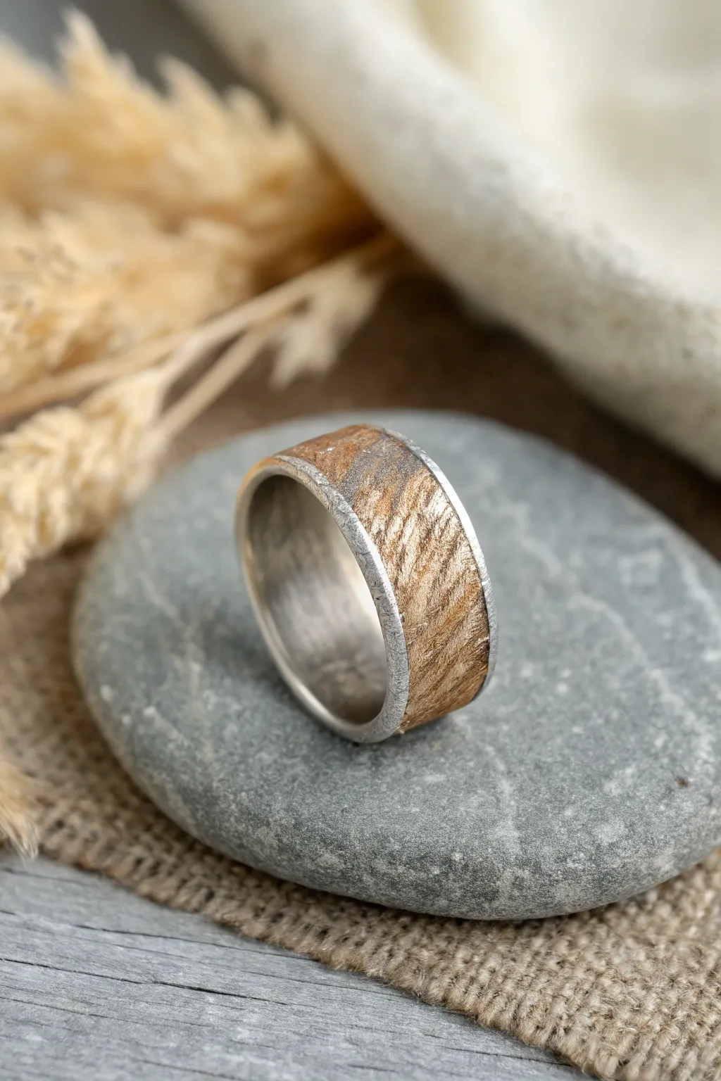 Wide textured metal clay band ring on stone, minimalist boho styling with bold contrast