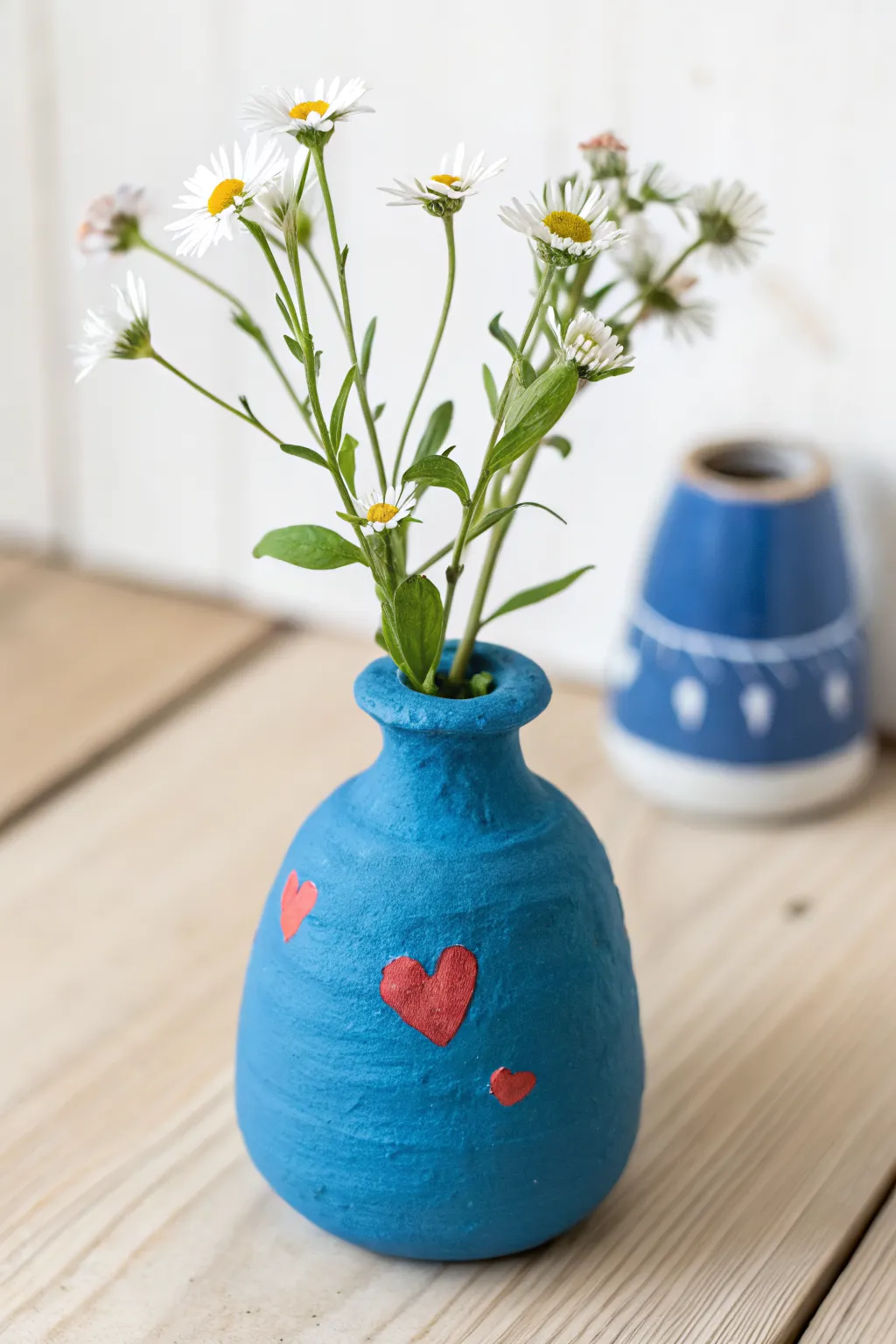 Petite air dry clay bud vase with wildflowers and a tiny heart, minimalist Mothers Day gift idea.