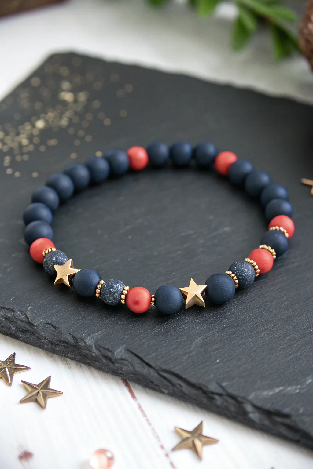 Firework burst clay bead bracelet with star spacers, bold midnight tones, minimal Nordic boho vibe.