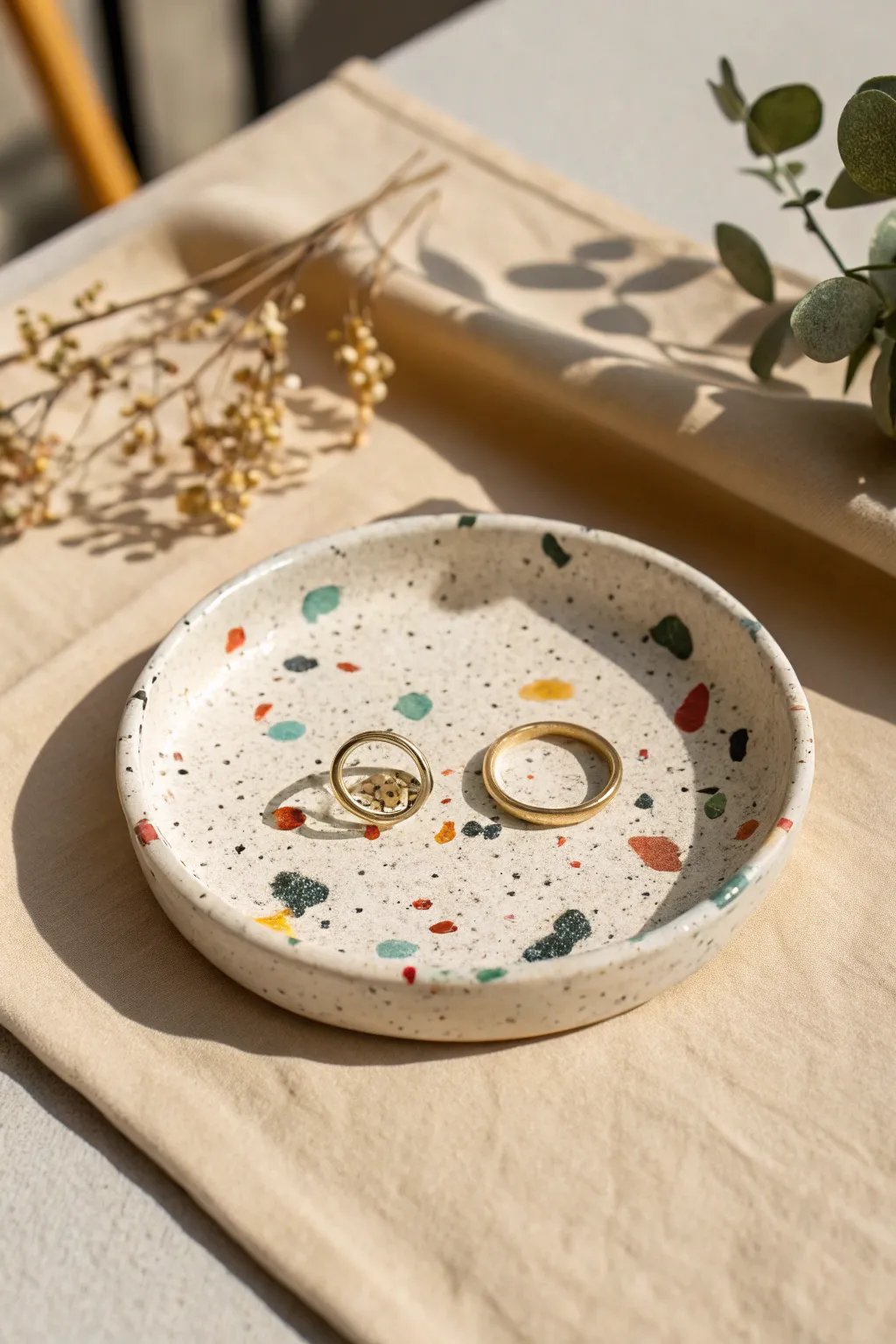 Terrazzo speckle polymer clay trinket dish with bold pops of color, perfect for rings
