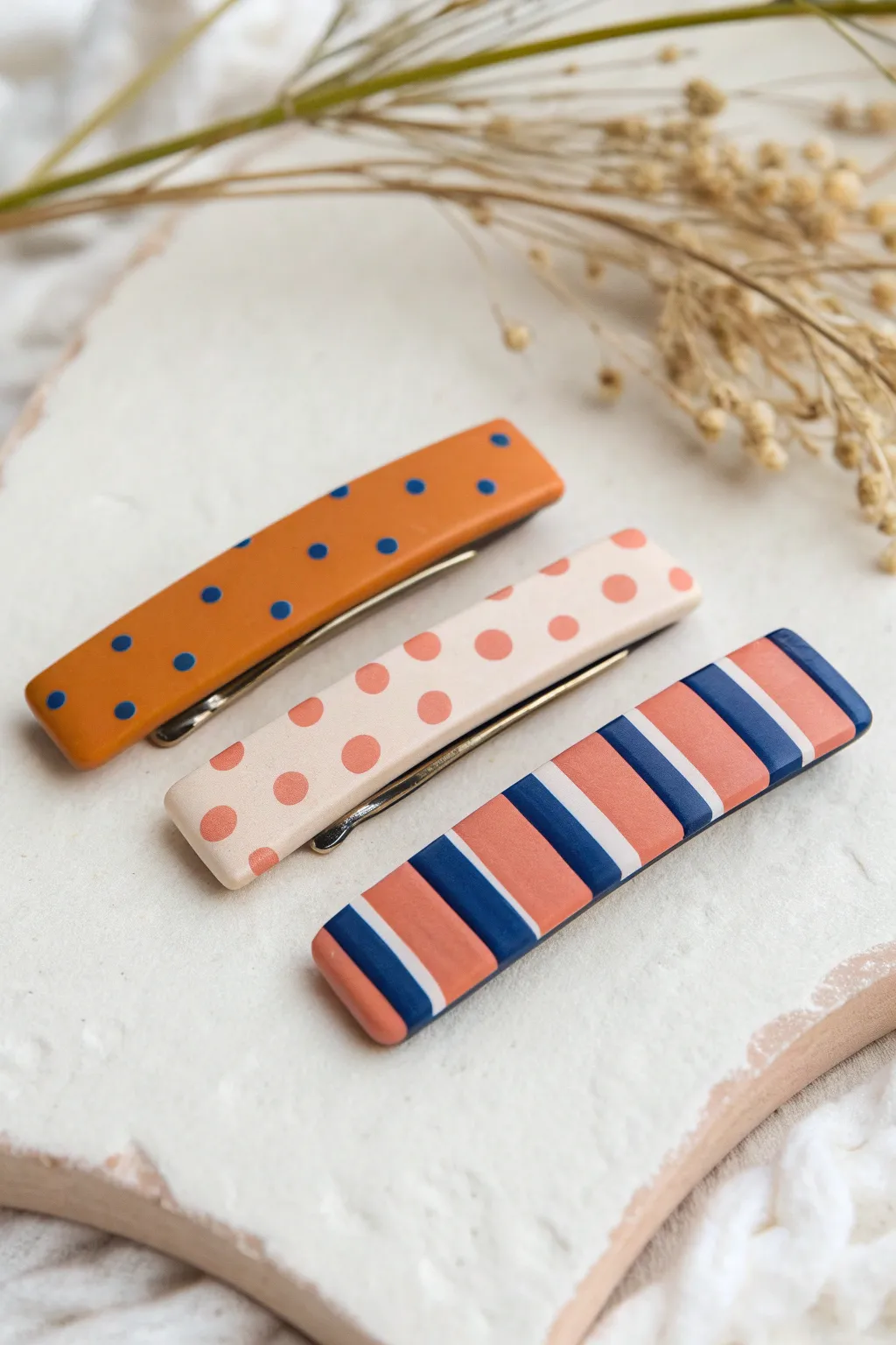 Bold striped and dotted polymer clay hair clips in a minimal Scandinavian-boho aesthetic