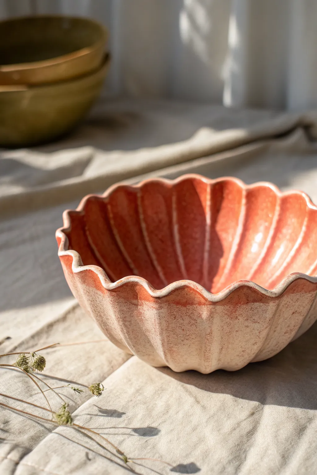 Wavy fluted polymer clay bowl in warm light, minimalist Scandinavian styling with bold color.
