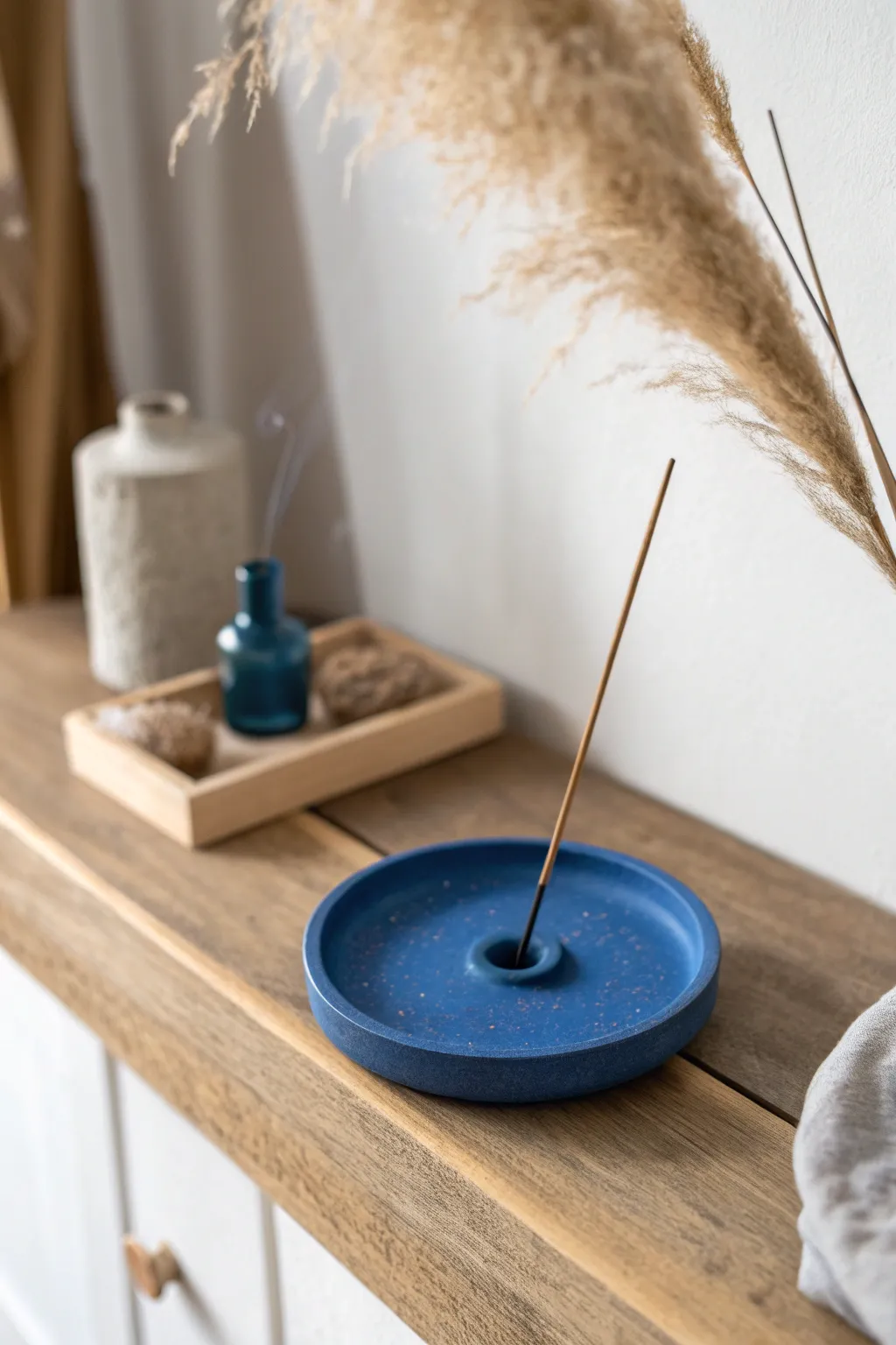 Minimal polymer clay incense holder in bold color, clean lines, and serene spa styling.