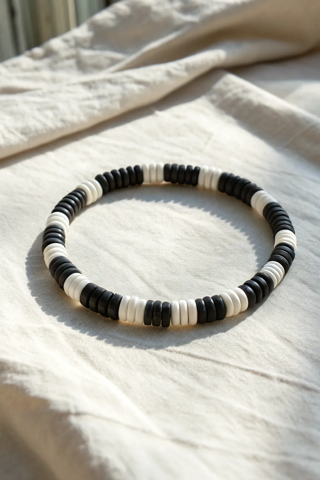 Graphic black and white heishi bead bracelet, Scandinavian minimal vibe with bold contrast