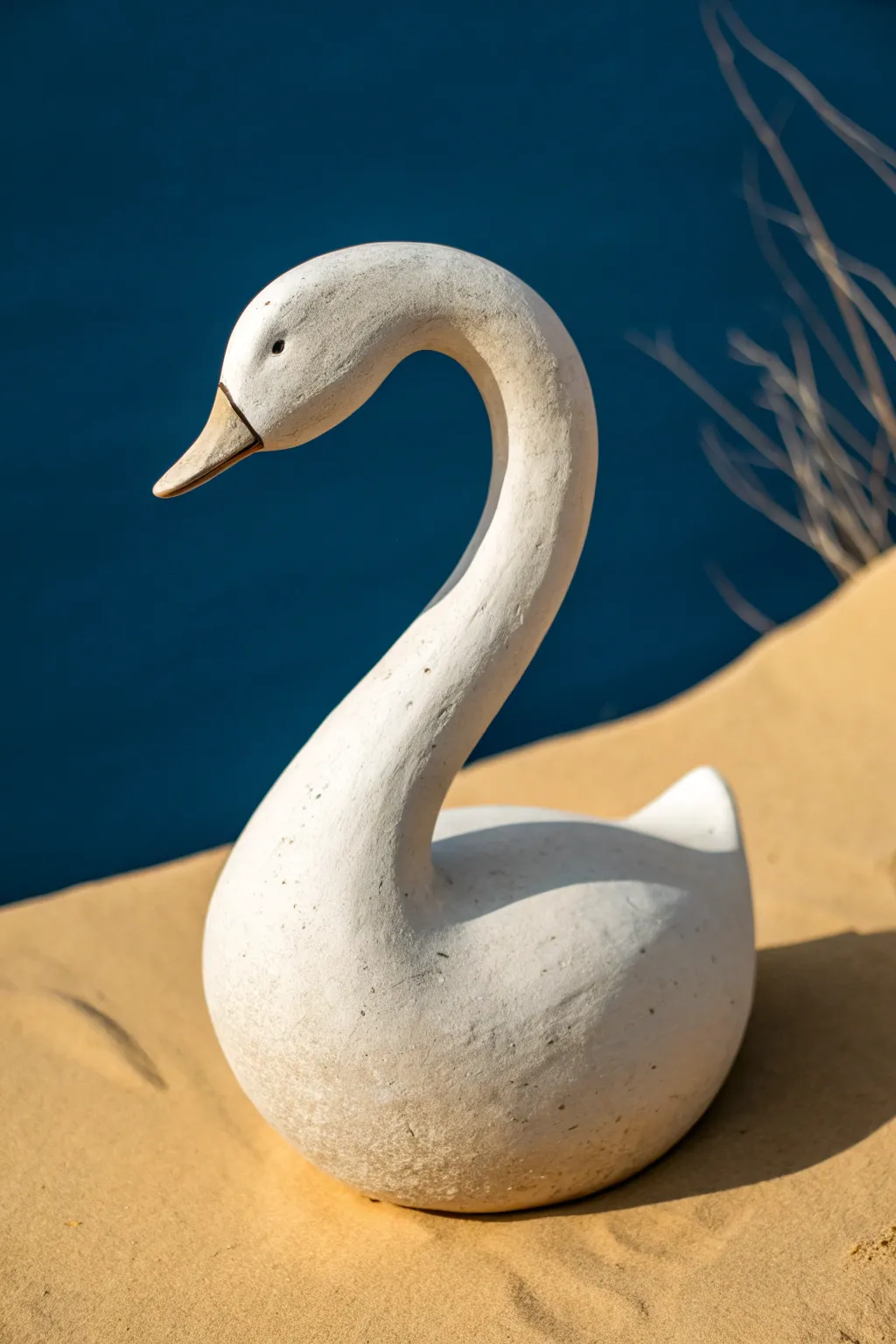 Minimal clay swan with an elegant S-curve neck, a simple sculpture idea anyone can try.