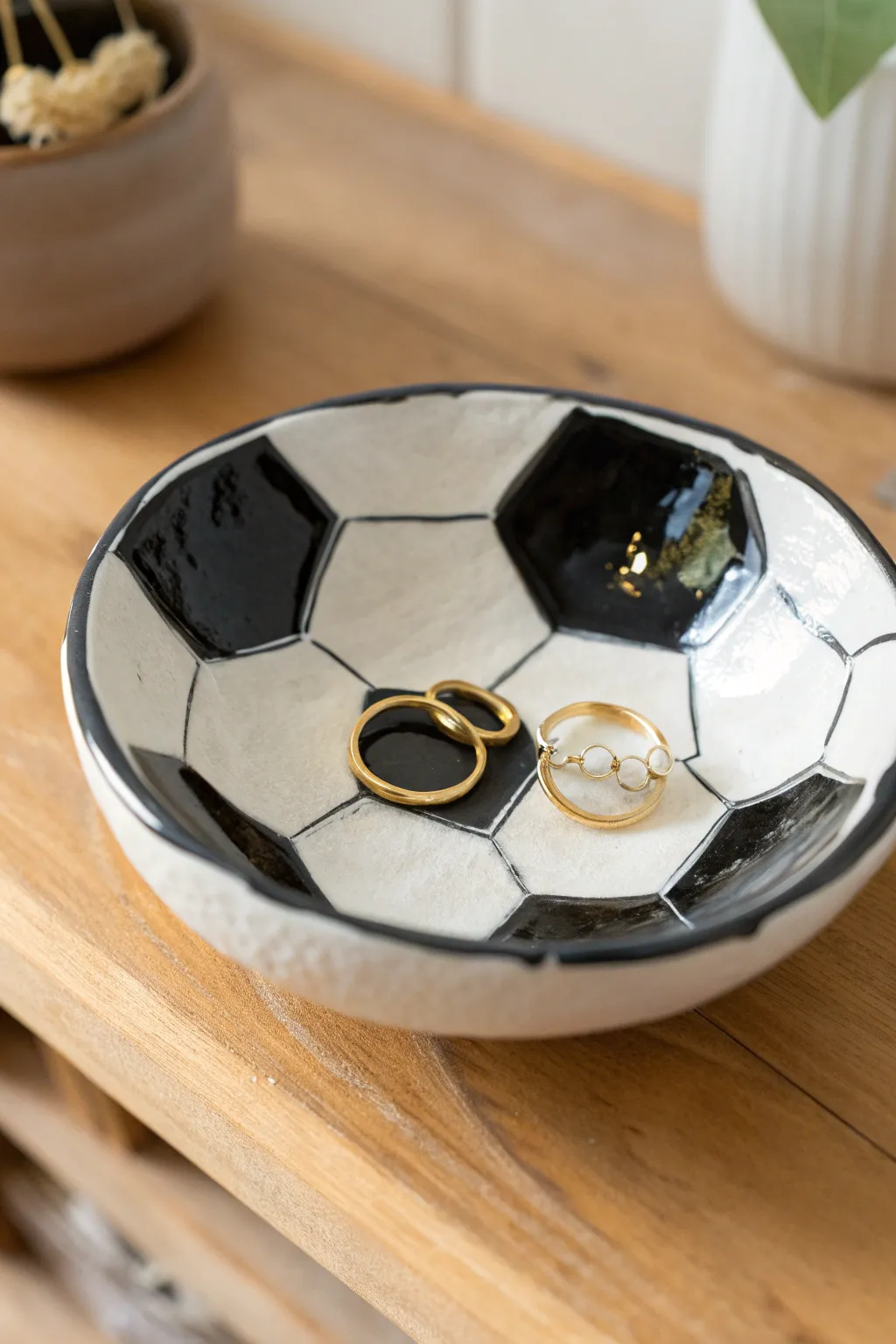 Handmade soccer ball trinket dish in bold glaze, perfect for rings and tiny treasures.