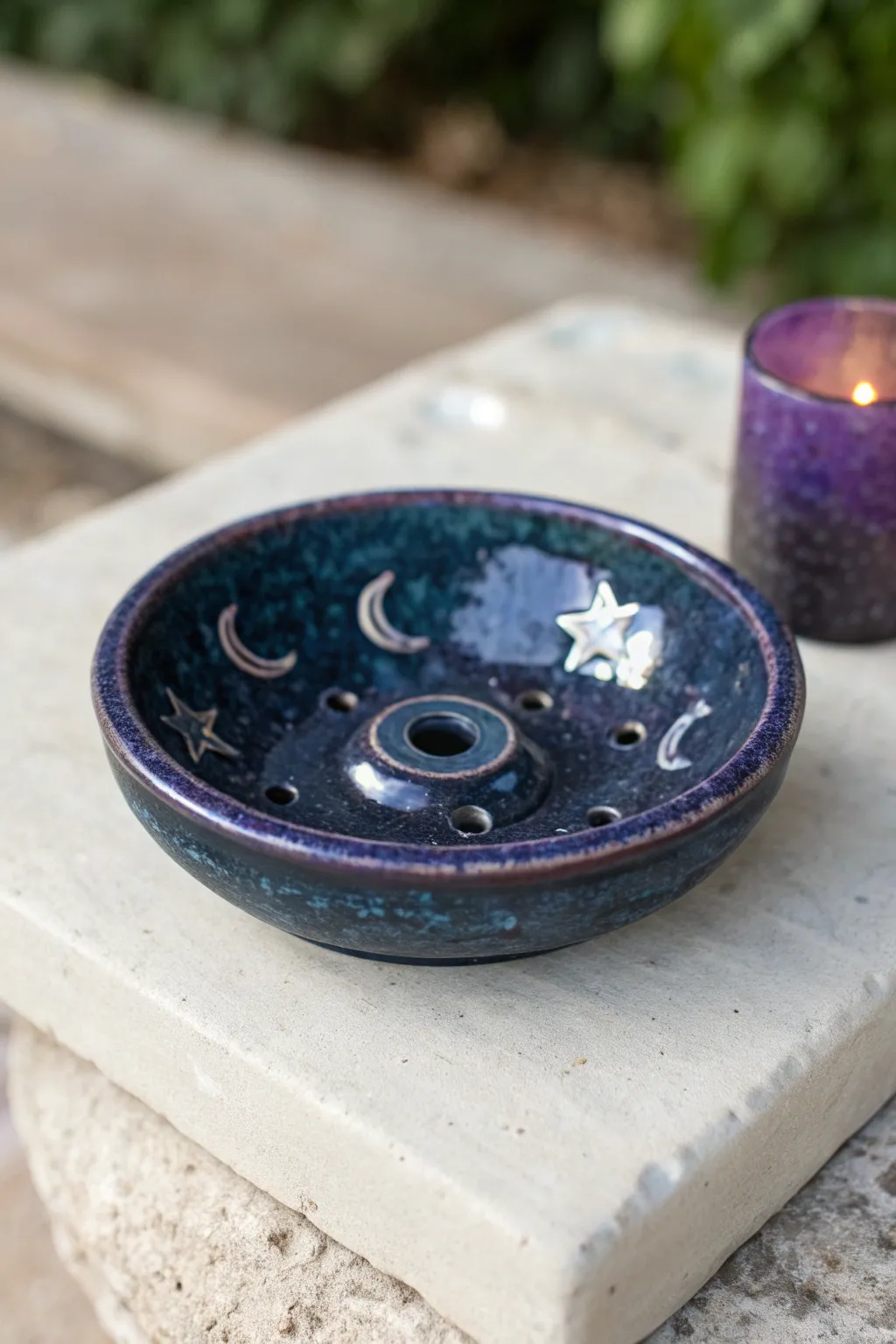 Midnight-blue celestial incense dish with moon and star relief, minimal boho mood and bold contrast.