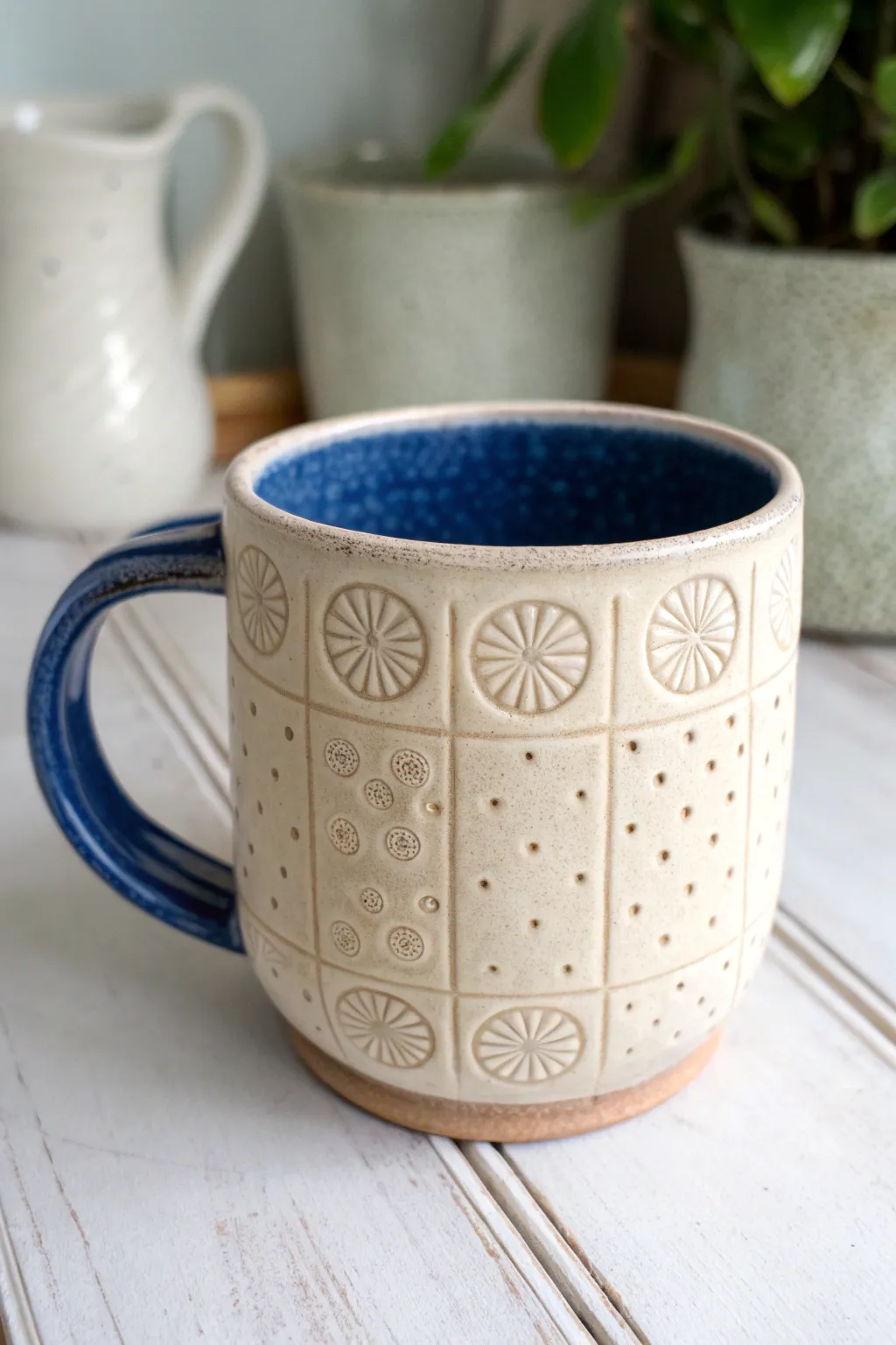 Stamped texture clay mug with bold dip glaze, minimalist Nordic styling and cozy boho warmth.