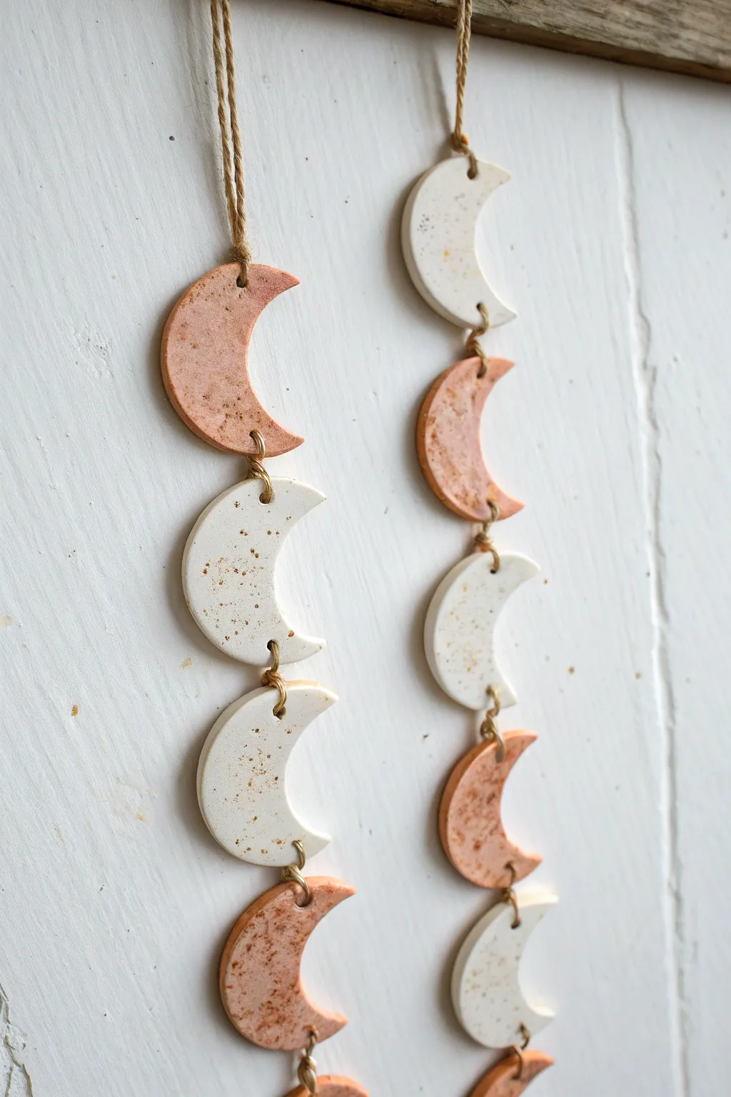 Soft speckled air-dry clay moon phase garland for a calm, minimalist boho wall moment