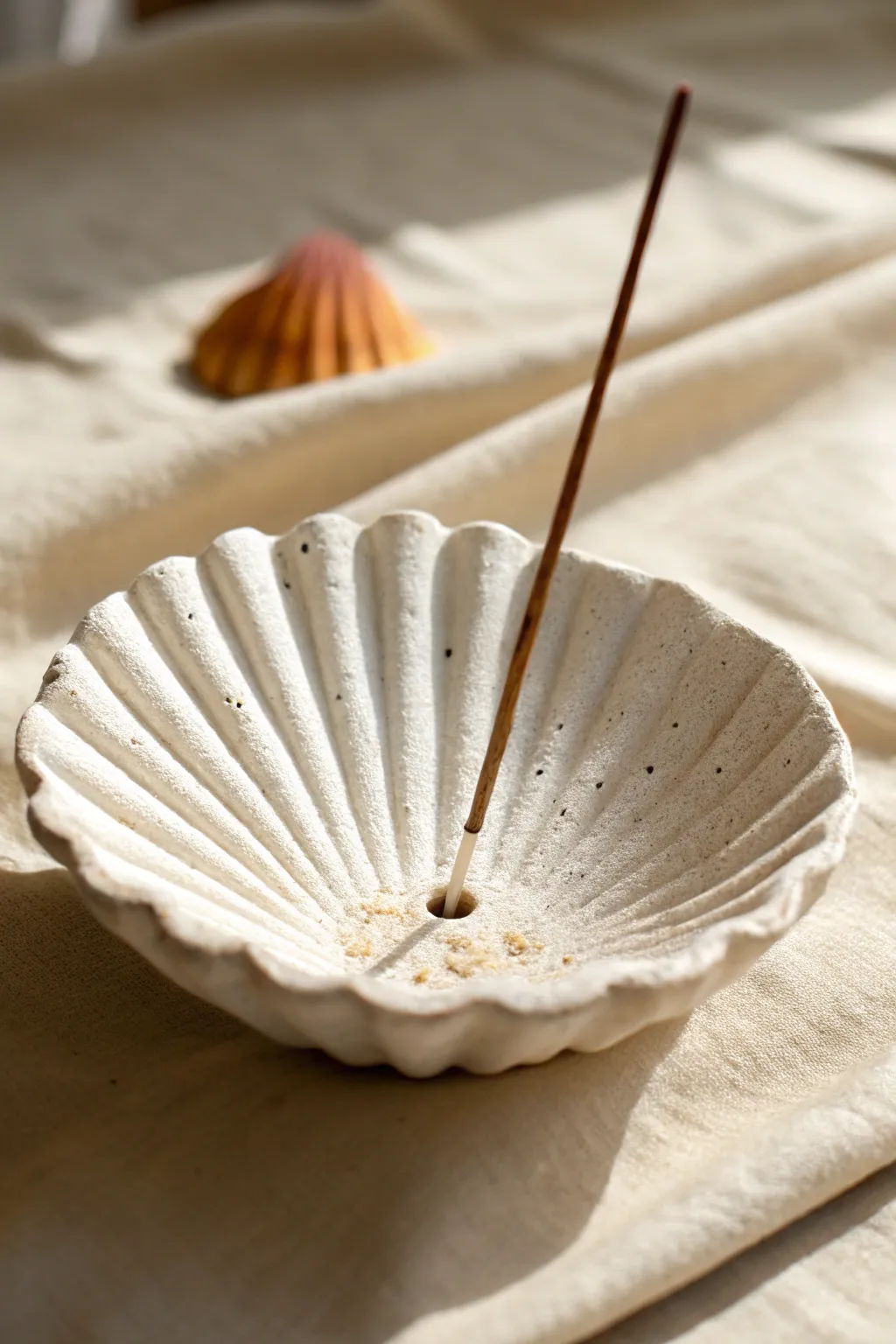Minimal scallop shell incense dish in air-dry clay, with ridges and ash-catching bowl