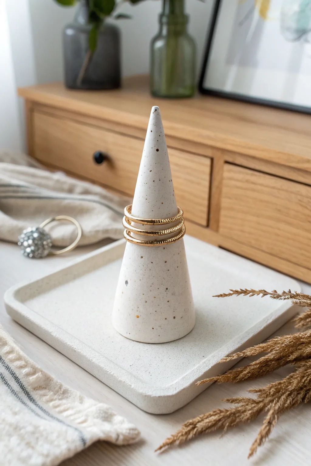 Minimal ring cone stand in air dry clay, a chic way to store rings with Nordic calm.