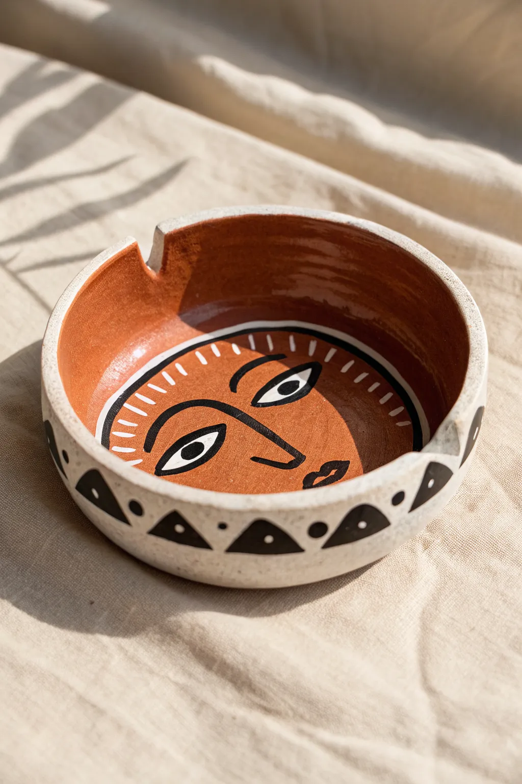 Surreal face clay ash tray with sculpted lips and painted eyes for a bold minimalist look