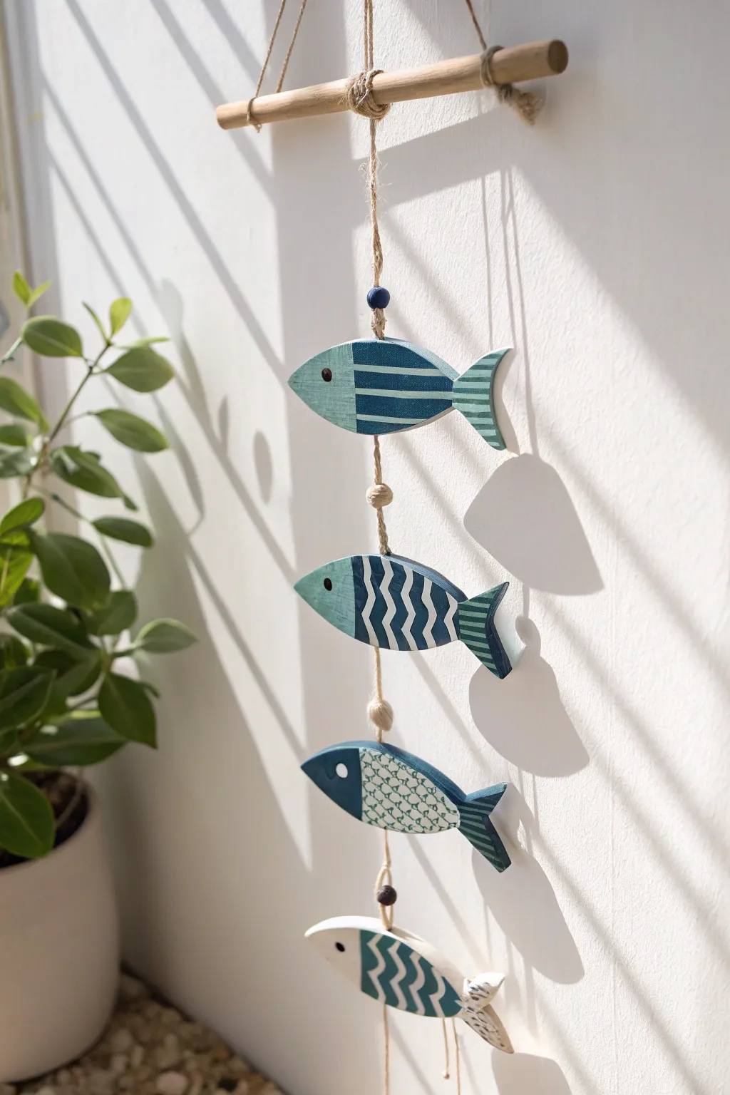 Coastal striped clay fish garland for a breezy, minimalist beach vibe in your home.