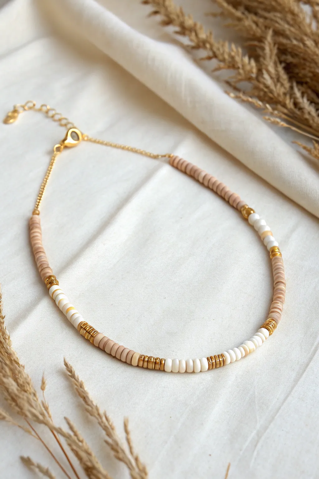 Tiny curved clay heishi bead bar choker with delicate chain, minimal and softly boho