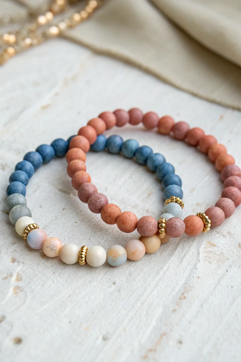 Twin best-friend clay bead bracelets with cool and warm ombre fades in minimalist boho style