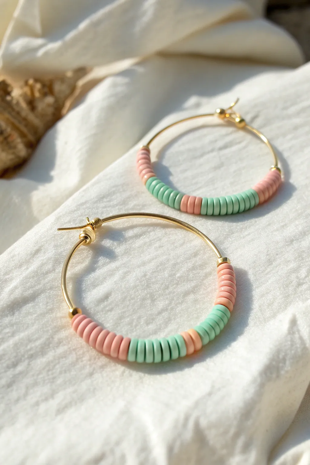 Pastel sorbet striped heishi hoop earring in mint, lilac, and peach, minimal and chic.