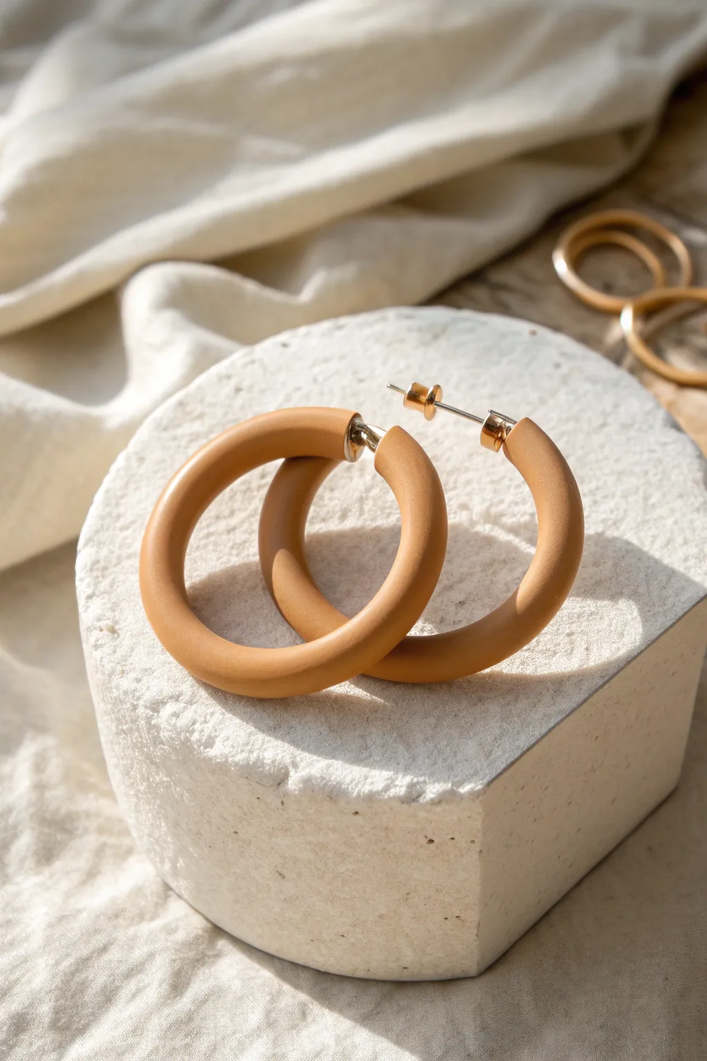 Chunky clay hoop illusion earrings in a warm neutral tone, minimal and effortlessly boho.