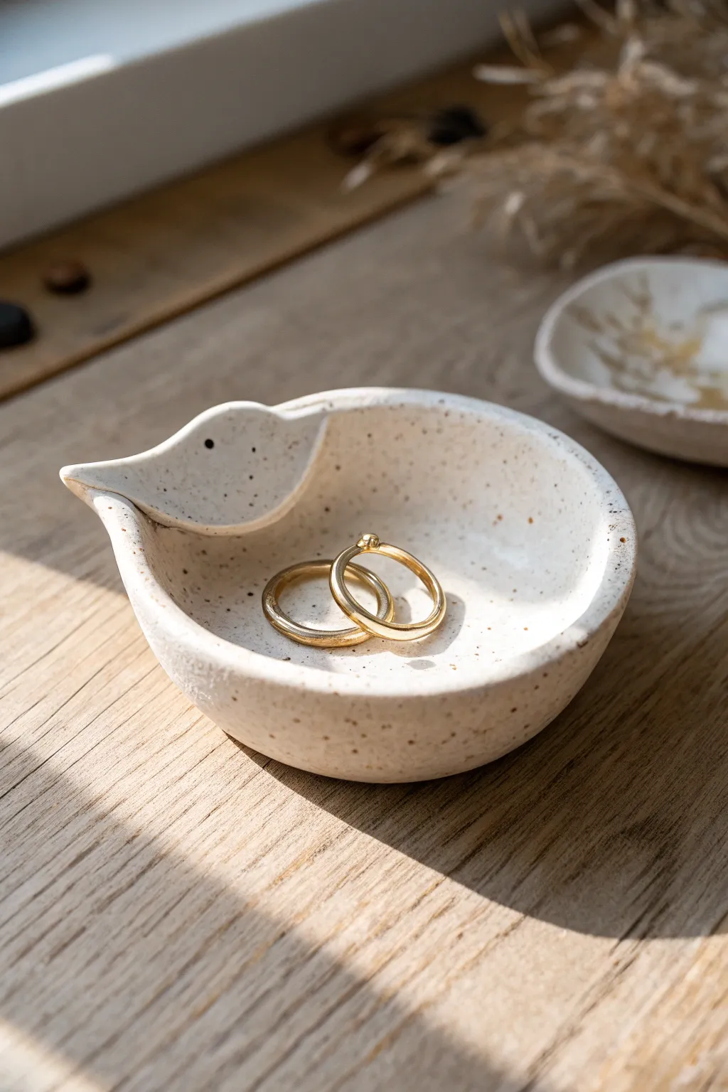 Sweet duck-shaped ring dish with beak rim, minimalist clay charm for your nightstand.