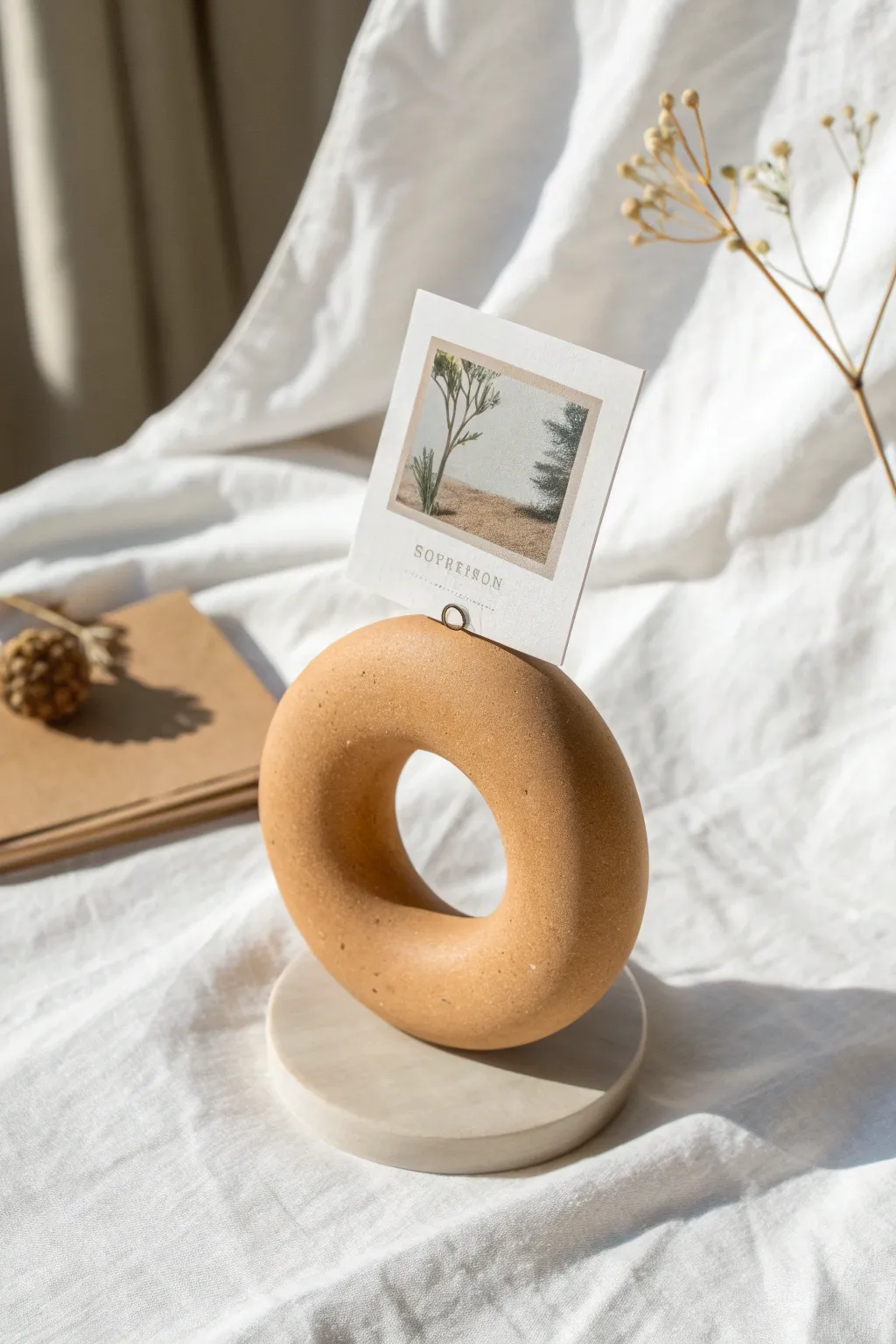 Minimal clay circle ring photo holder, matte and modern for Scandinavian boho styling.