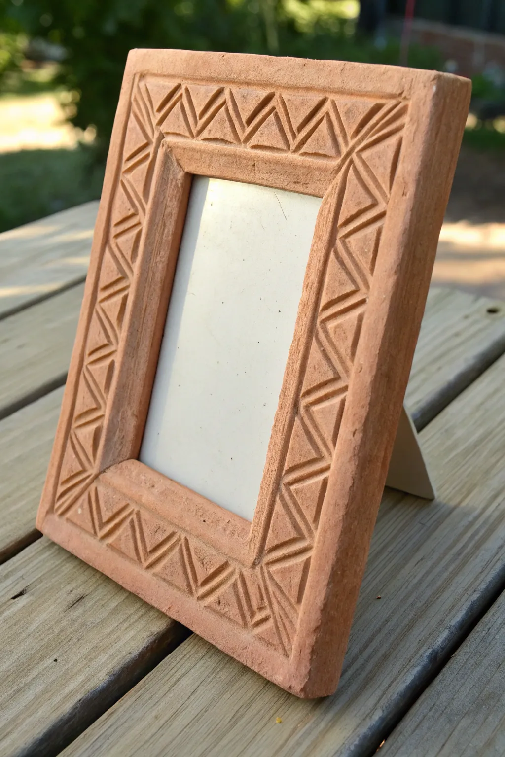 Coil clay picture frame with simple stamped texture, a sturdy middle school project that looks chic.