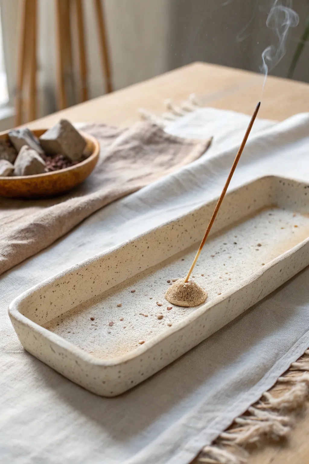 A minimalist slab incense tray with curled edges, designed to catch ash neatly and beautifully.