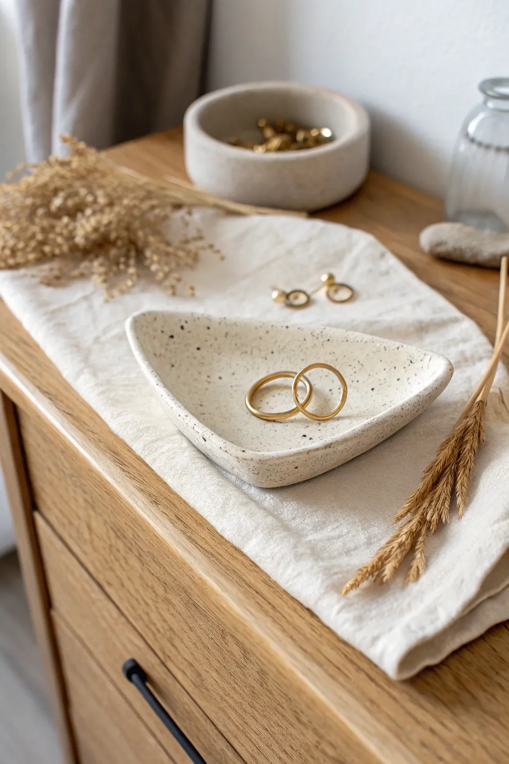 Curved slab jewelry dish with lifted edge, perfect for rings and earrings on your dresser.
