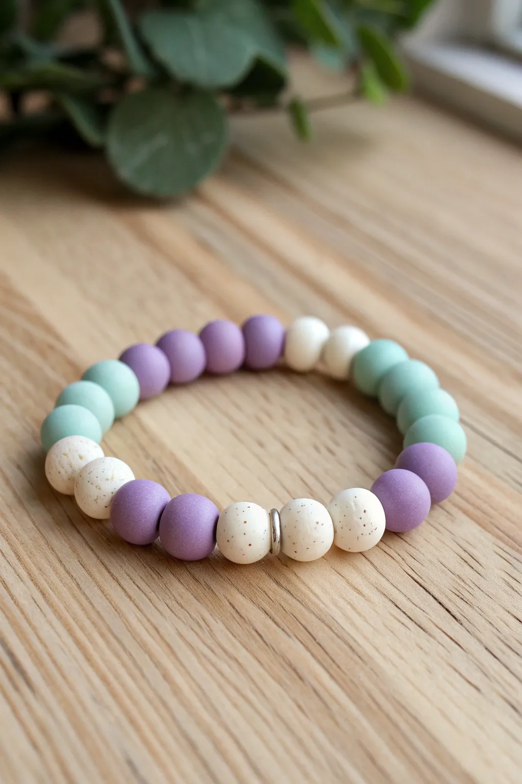 Chunky color-block clay bead bracelet in lilac, white, and mint with tiny spacers