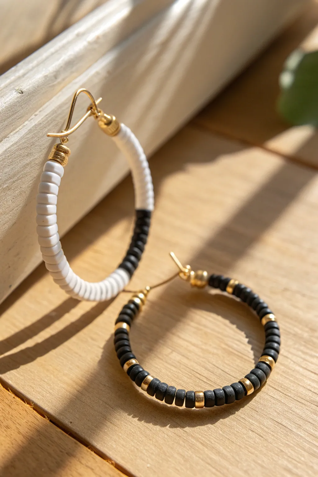Checkerboard-inspired clay disc bead hoop in crisp black and white, minimal and beautifully handmade