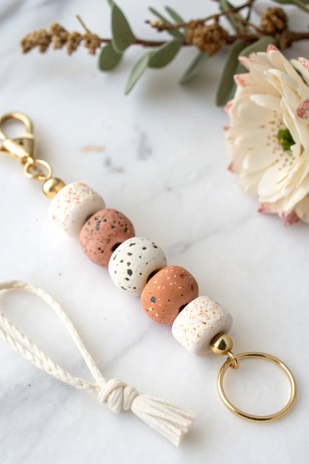 Terrazzo confetti clay bead keychain in soft neutrals, minimalist stack with boho warmth.