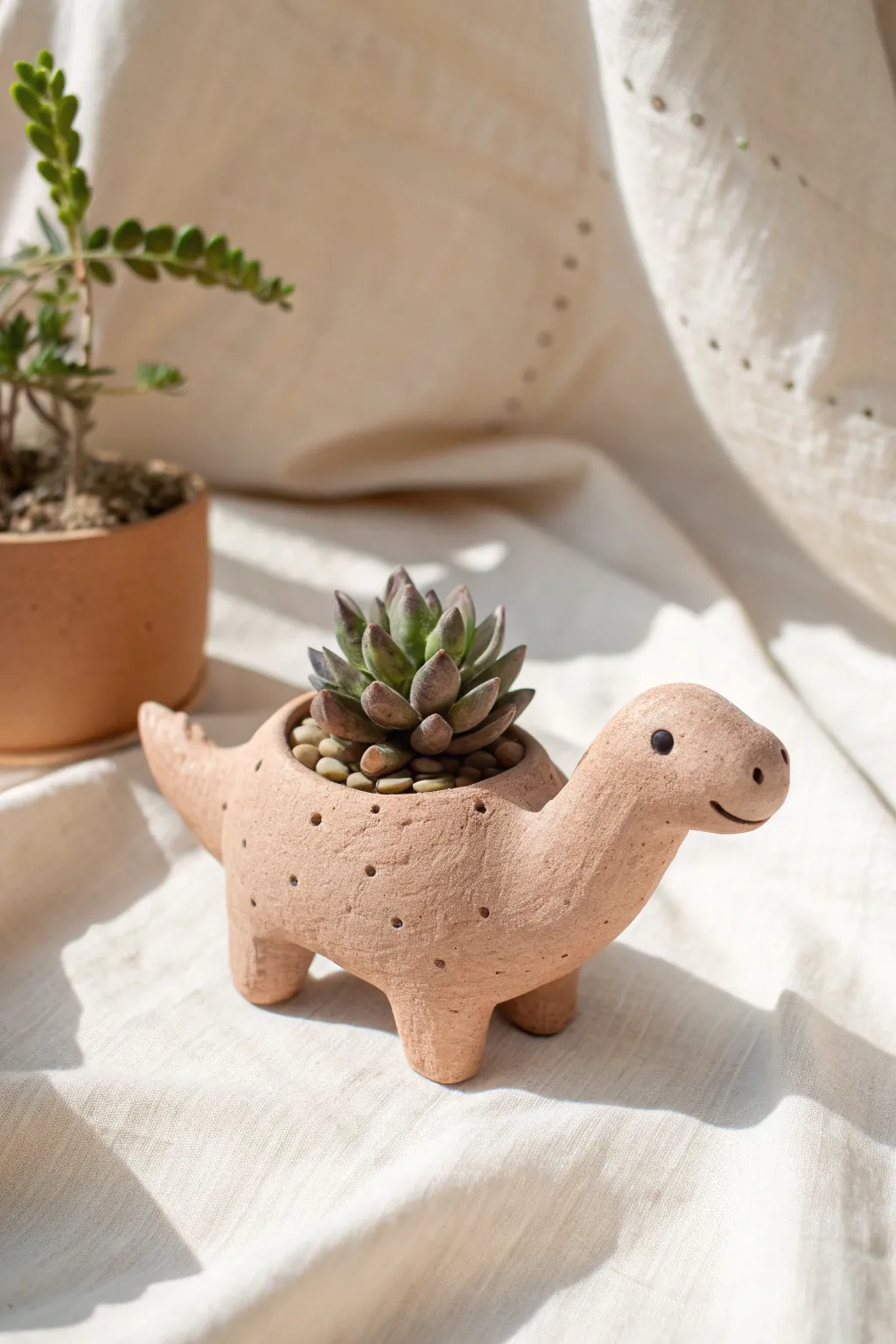 Adorable dino mini planter with a tiny tail and succulent, perfect for playful pottery decor