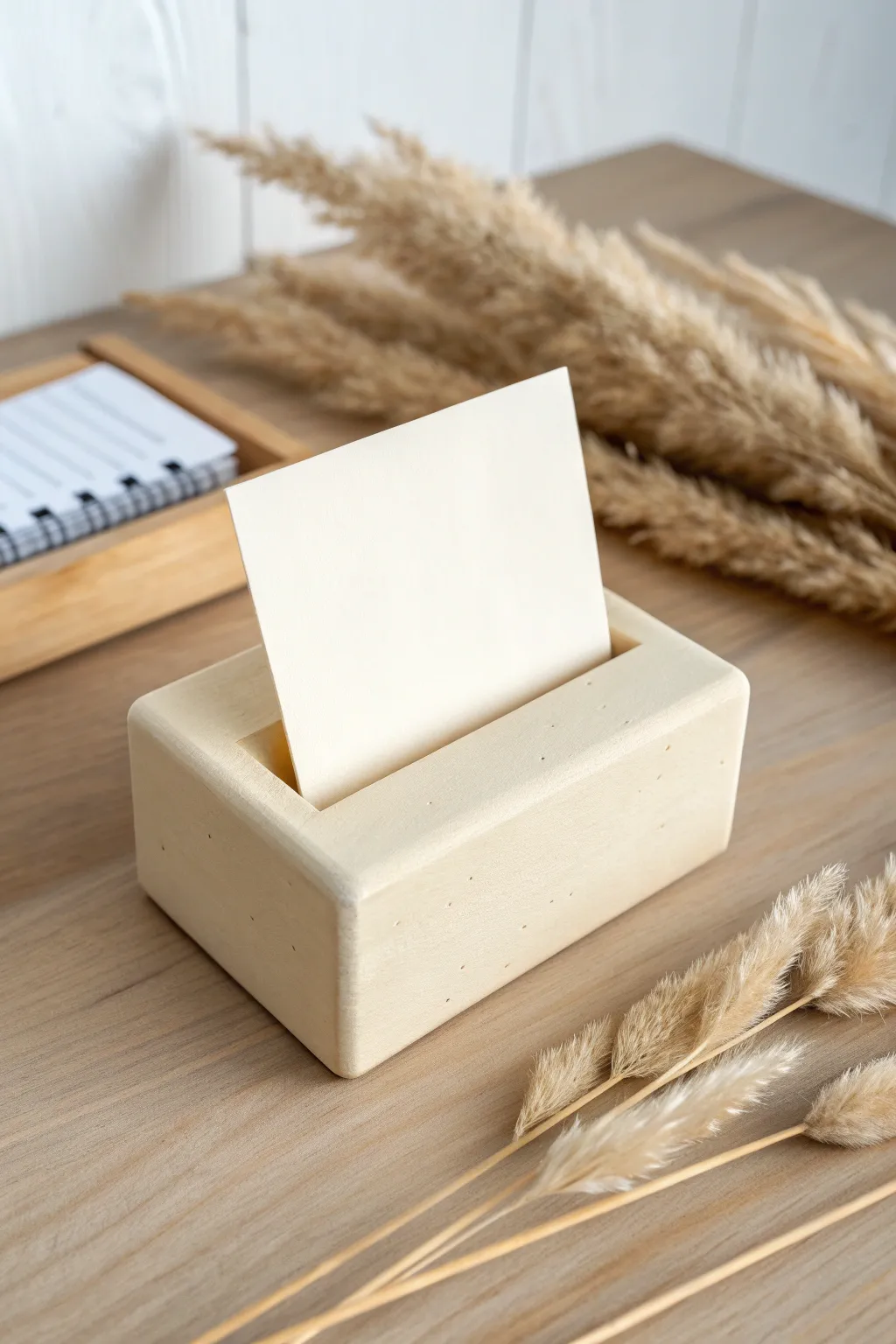 Simple air-dry clay card stand with soft texture and neutral styling for easy, modern decor.