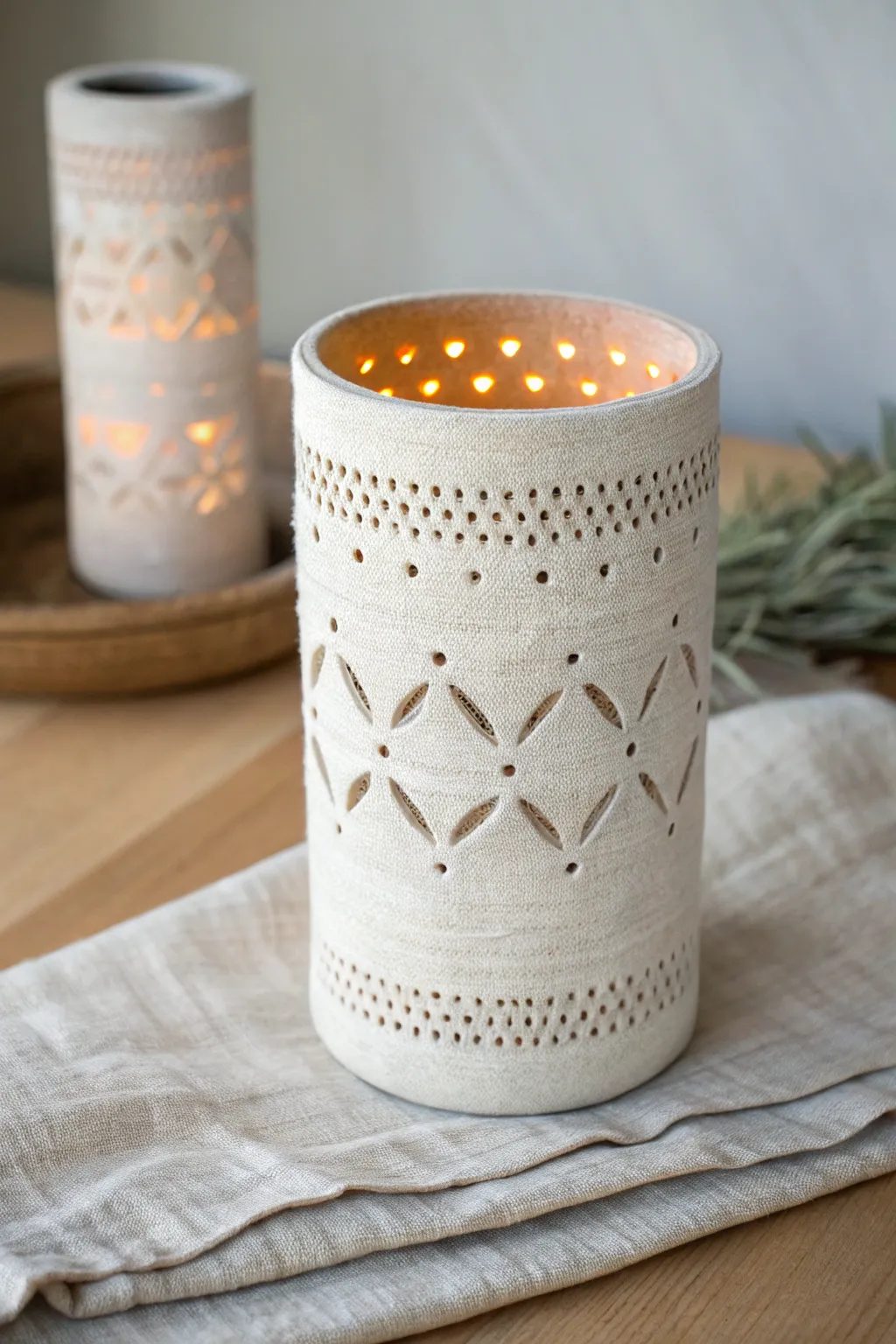 Softly glowing textured clay lantern with pierced pattern, simple DIY warmth for cozy nights.