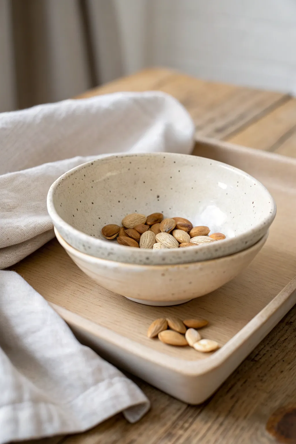 Minimal slab bowl slumped over a simple mold, softly lit to highlight clean curves and texture.