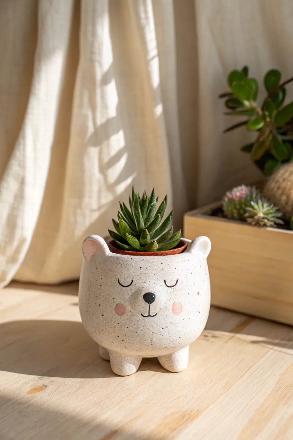 A whimsical bear planter with a tiny succulent, minimalist and cozy for playful handmade decor.
