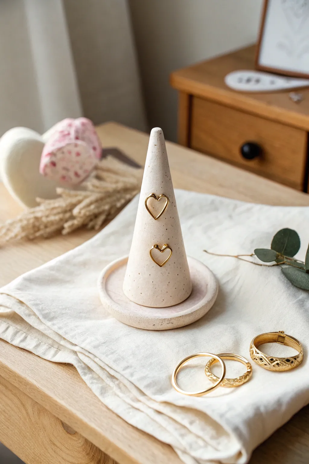 A sweet heart ring holder cone that keeps your rings safe, minimalist, cozy, and handmade.