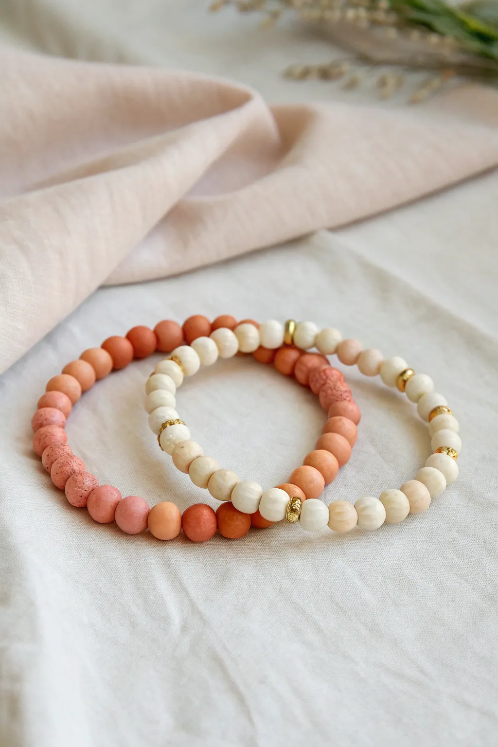 Ombré companion clay bead bracelets in coral, peach, and cream for a soft matched set