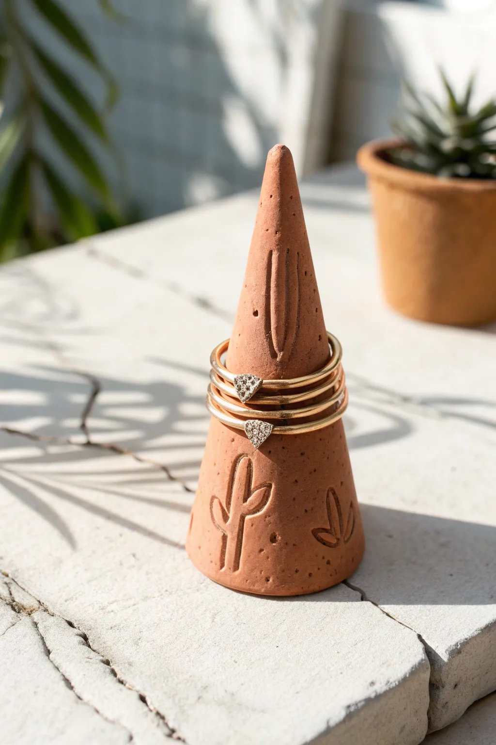 Minimal polymer clay ring cone with warm matte finish, styled in airy Scandinavian boho light.