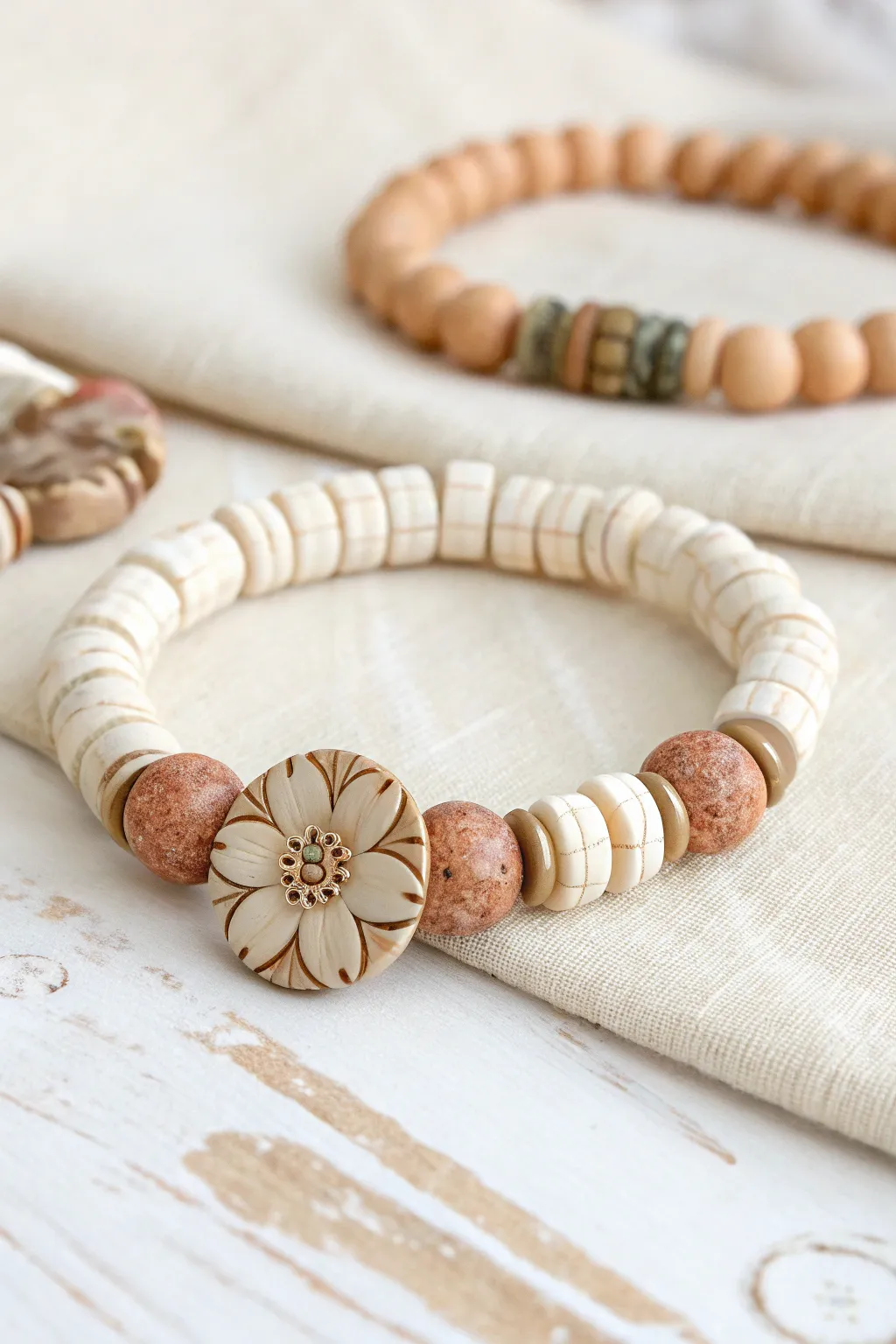 Minimal heishi bracelet with a bold polymer clay statement bead, simple and modern.