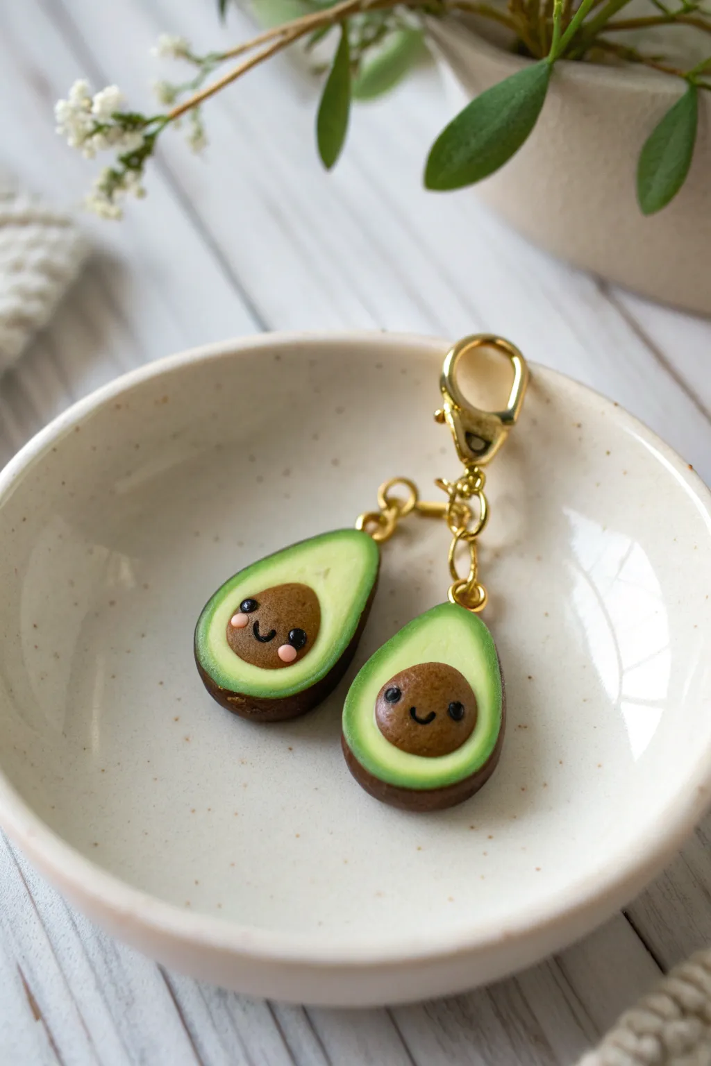 Mini polymer clay avocado charms with a sweet smiley pit, perfect beginner project inspiration